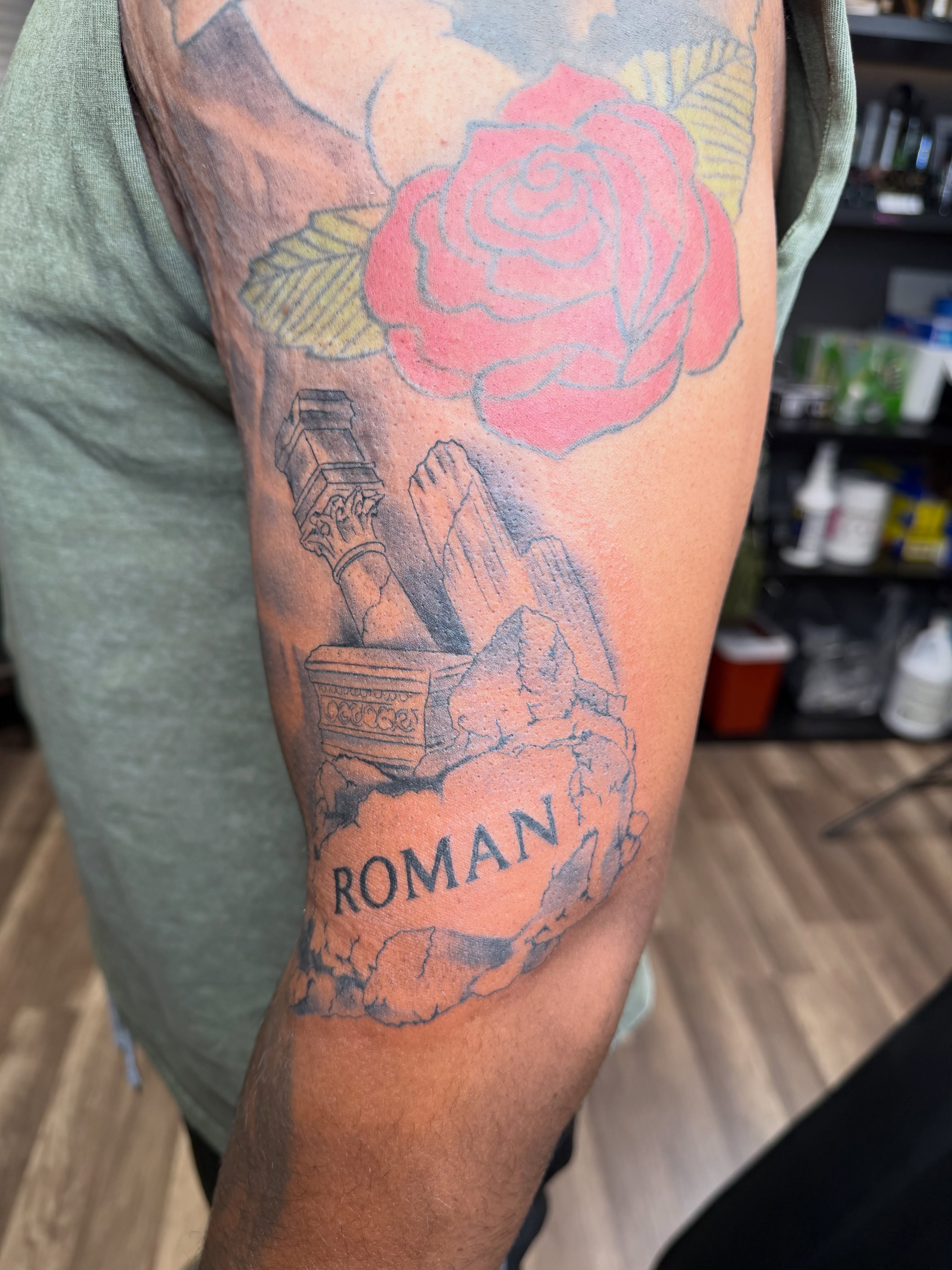 Rose and ruins American traditional tattoo on the forearm by Rain David