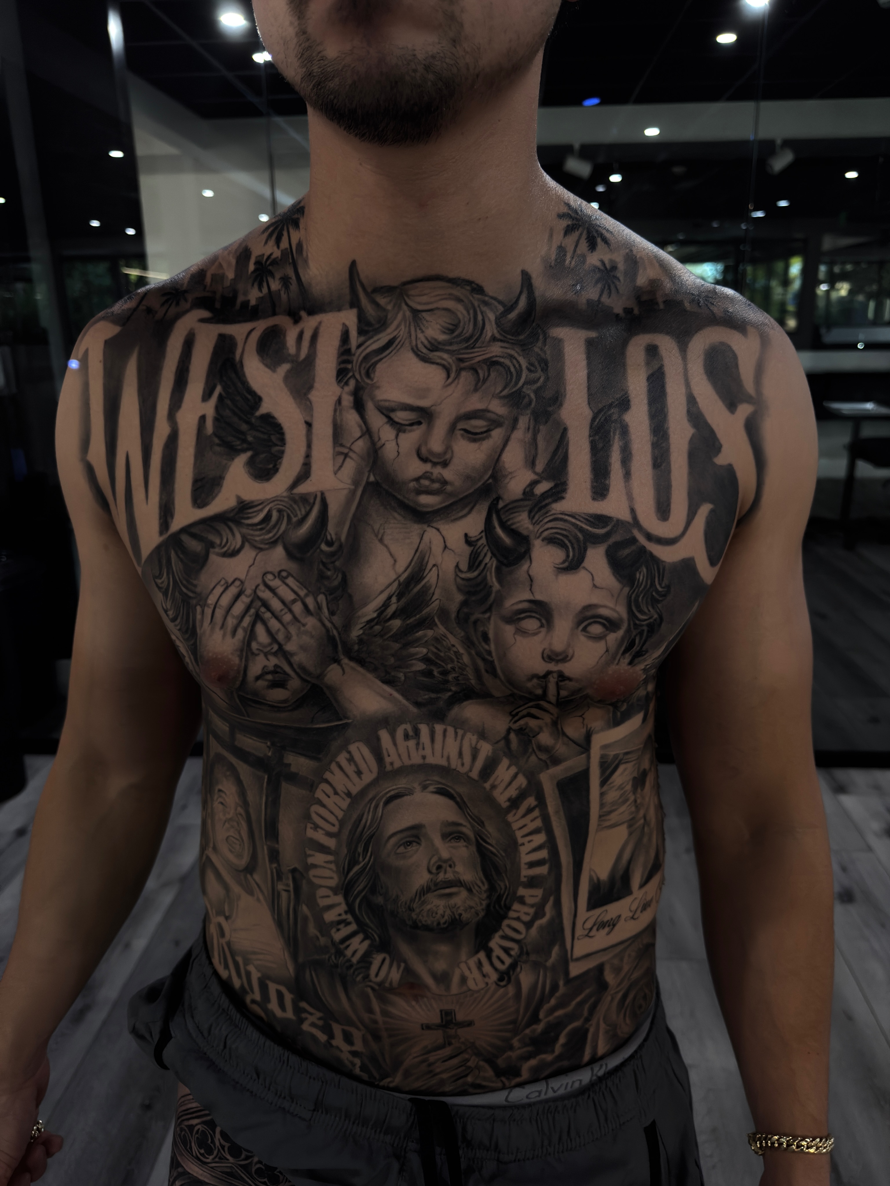 Religious imagery realism tattoo on the chest by Andy