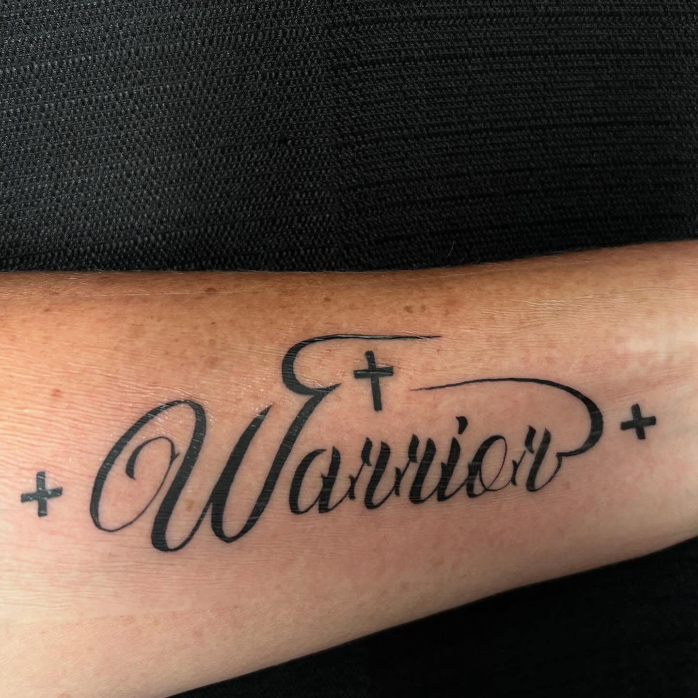 Warrior lettering script tattoo on the forearm by Pres!