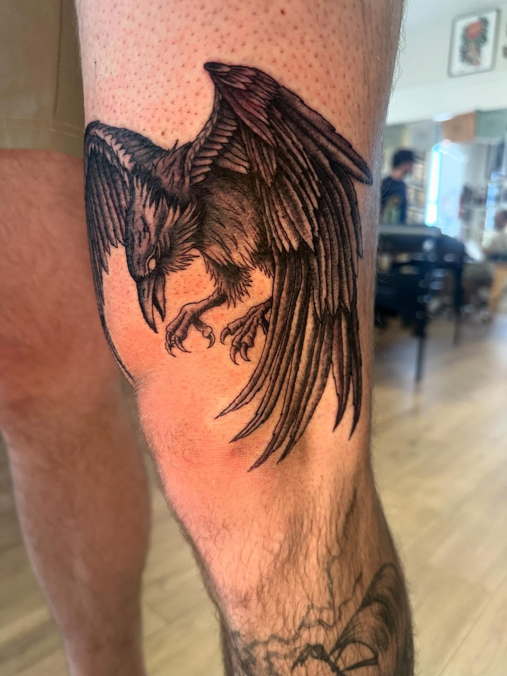 Raven black and grey tattoo on the forearm by Kaylee Woods