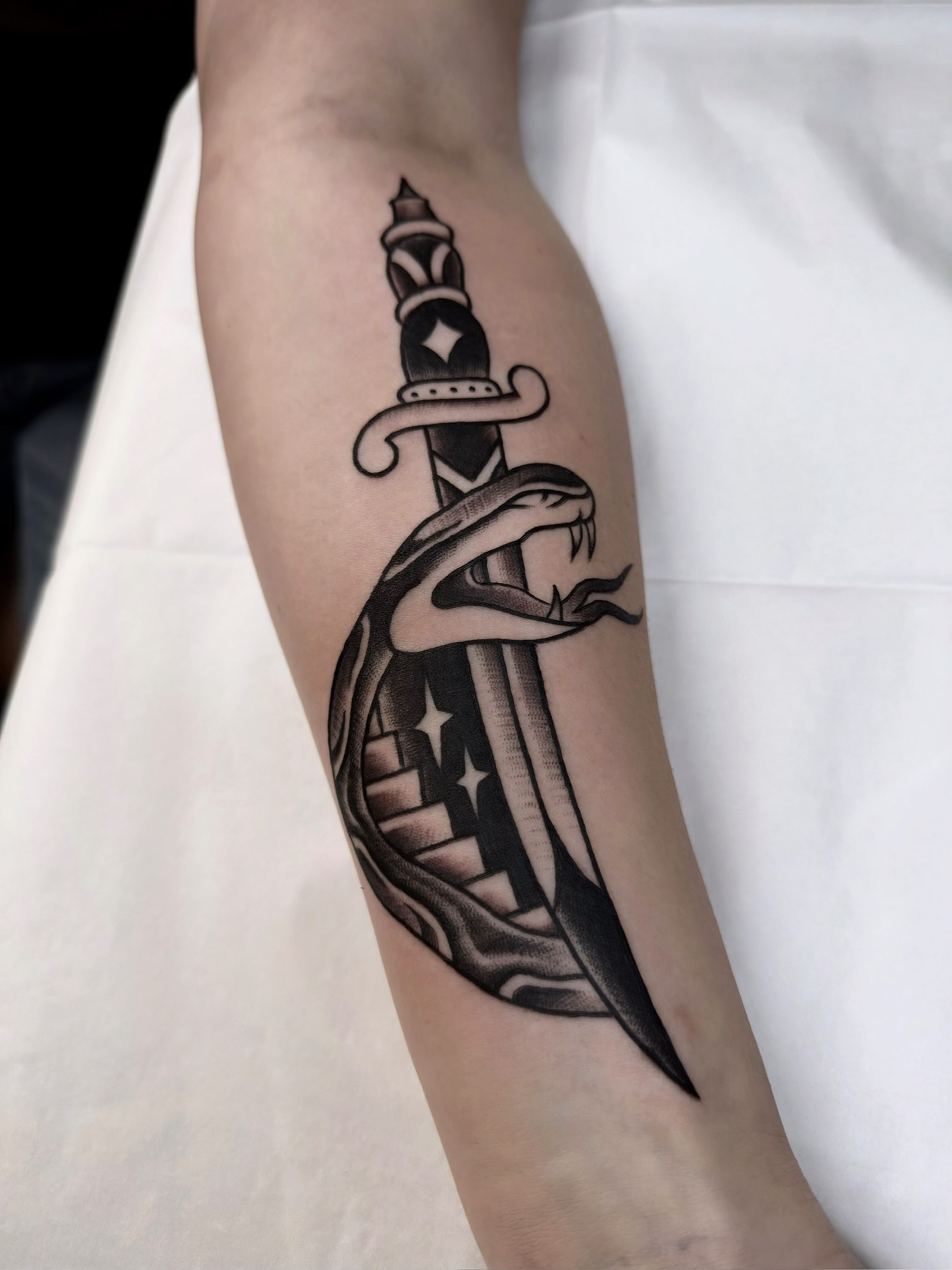 Knife and snake black and grey tattoo on the forearm by Trav, Bayville, New Jersey