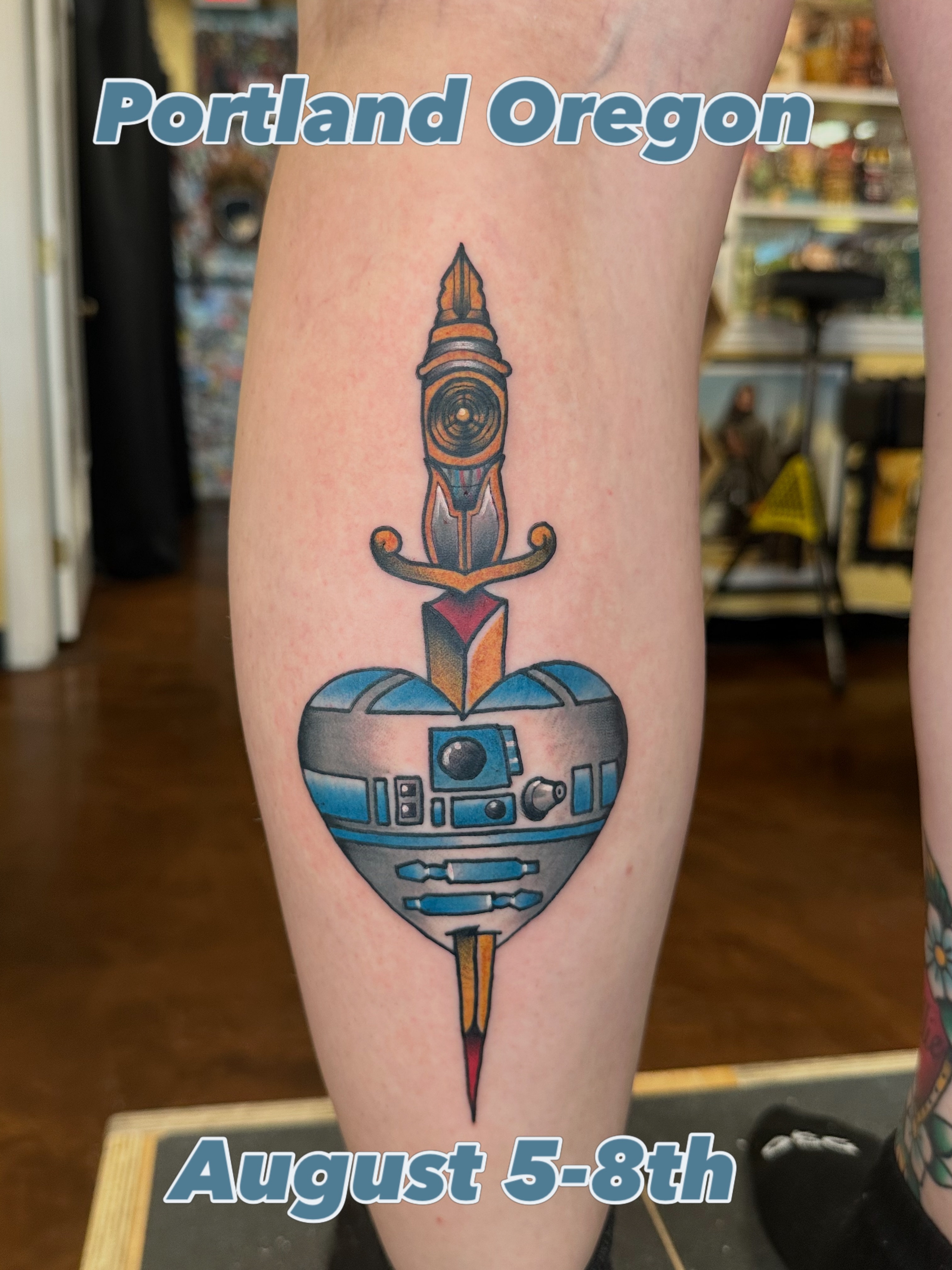 R2-D2 heart with sword American traditional tattoo on the forearm by Nick Bones, Las Vegas, Nevada