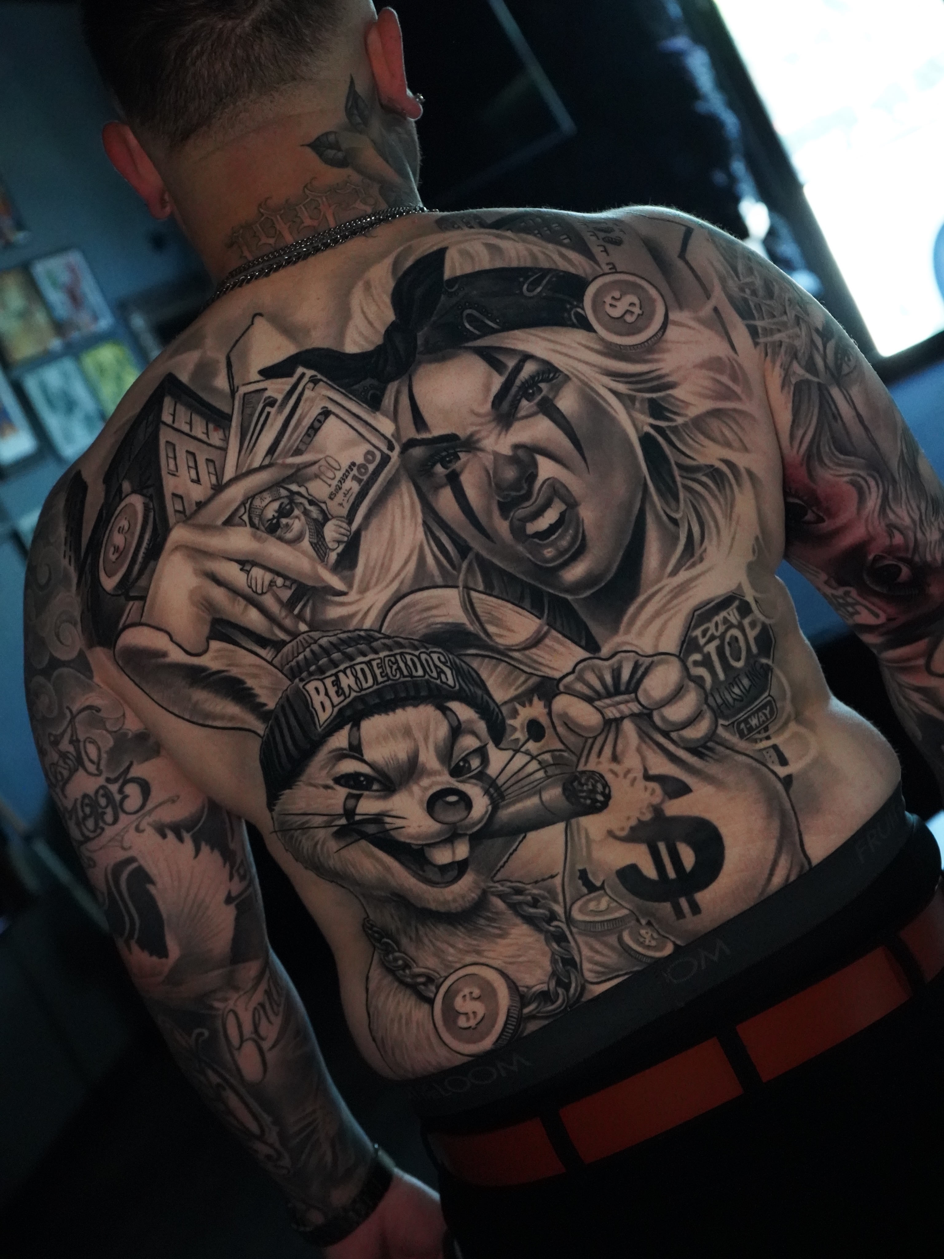 Gangster woman and cartoon character realism tattoo on the back by Jose Mendoza Torres