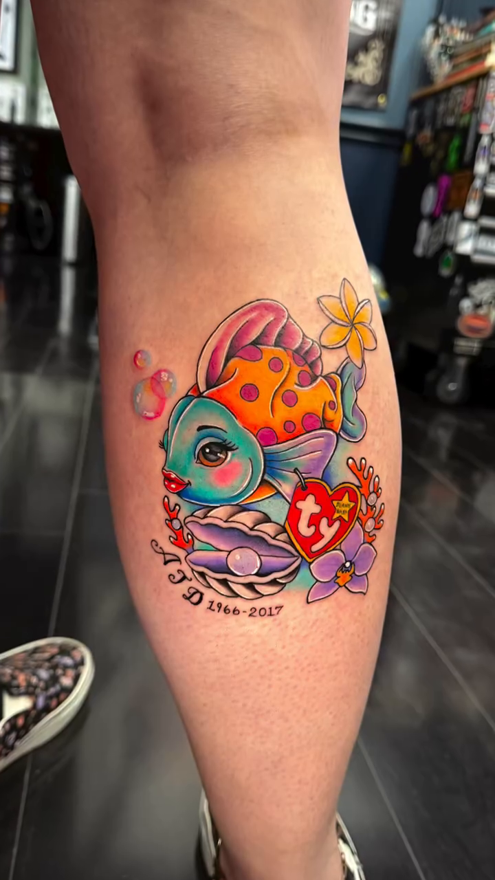 Fish with beanie baby tag neo-traditional tattoo by Tattoos by Rey G.
