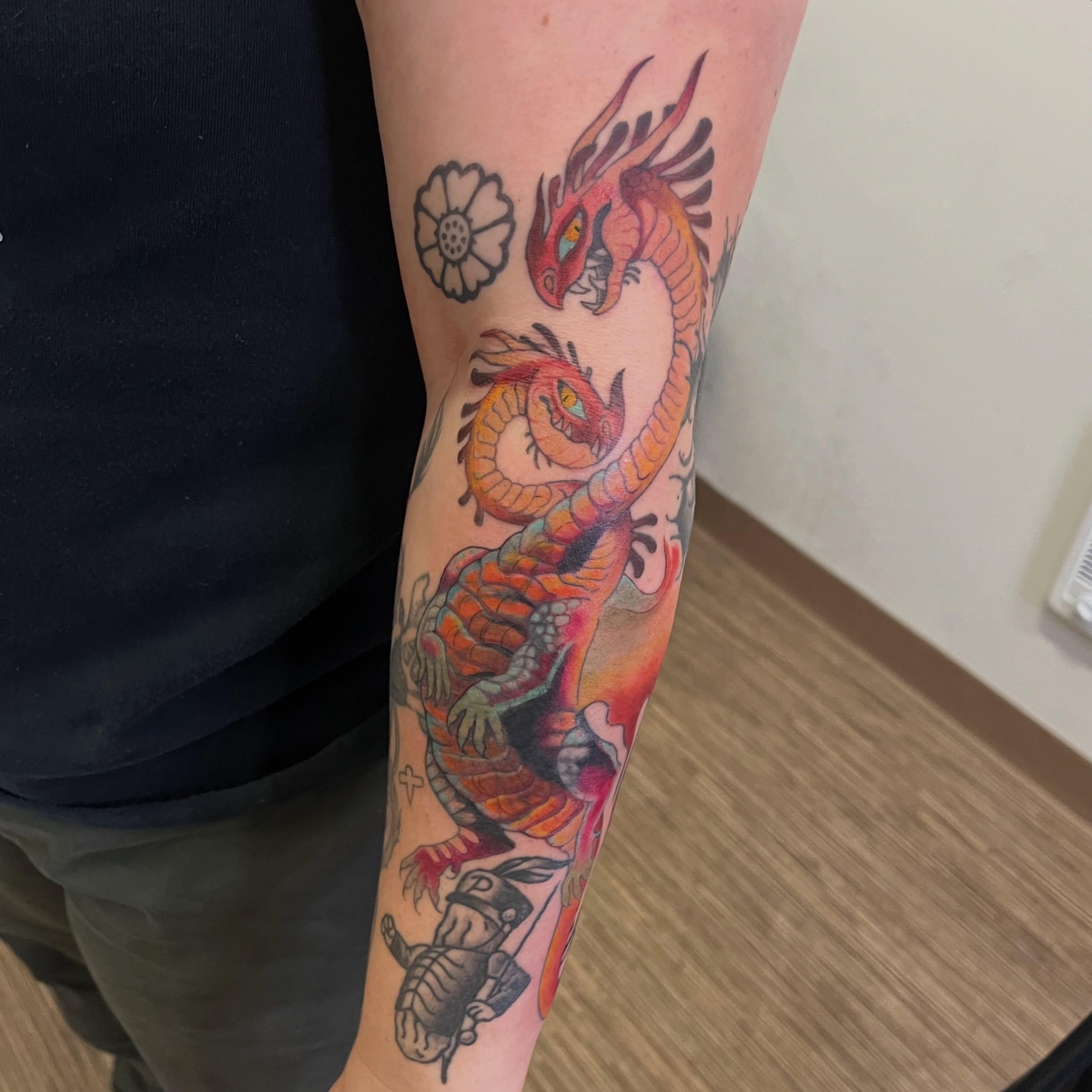 Dragon and flower American traditional tattoo on the forearm by Lacey B, Portland, Oregon