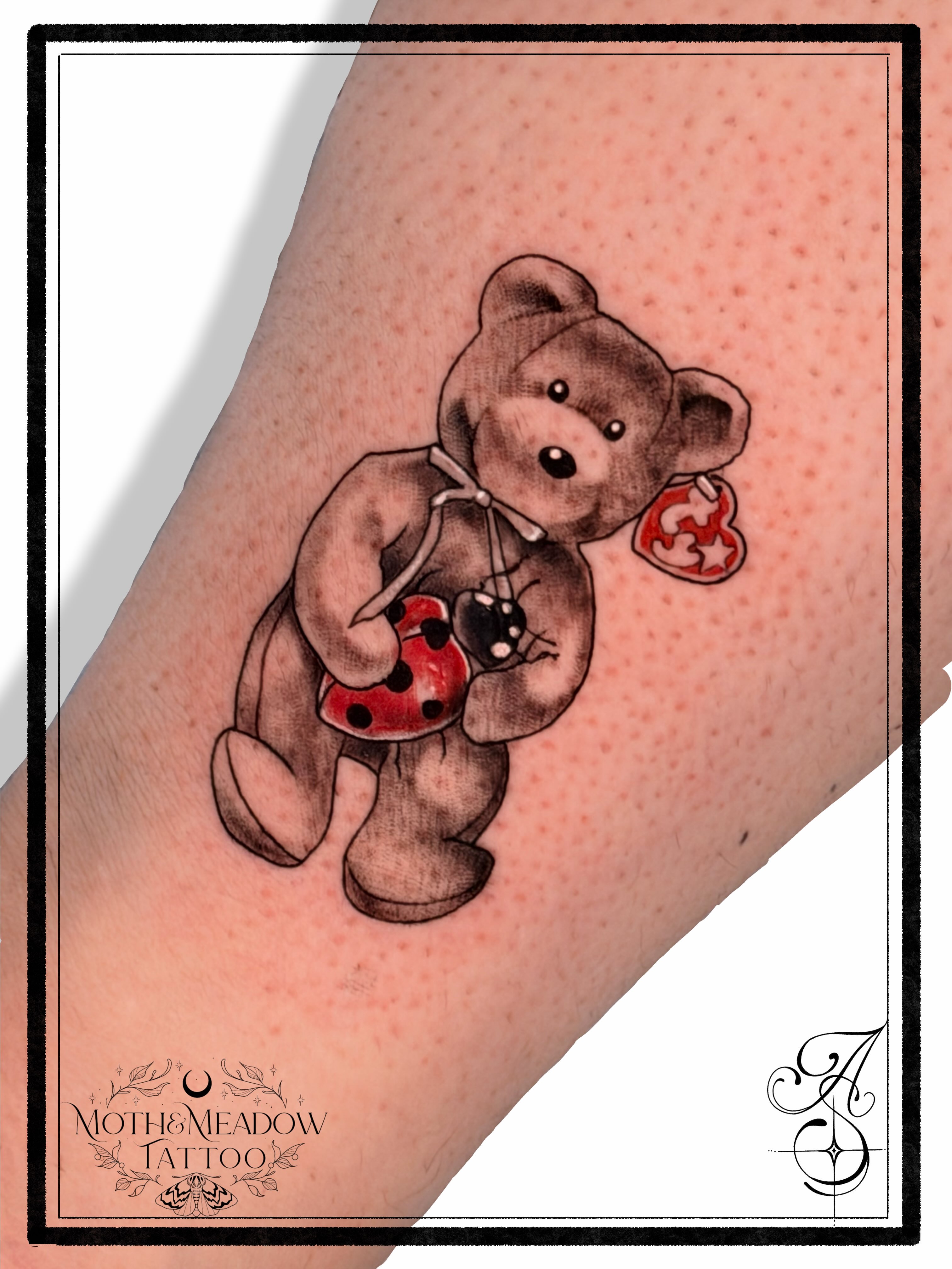 Teddy bear realism tattoo on the forearm by Ash Sansoucie