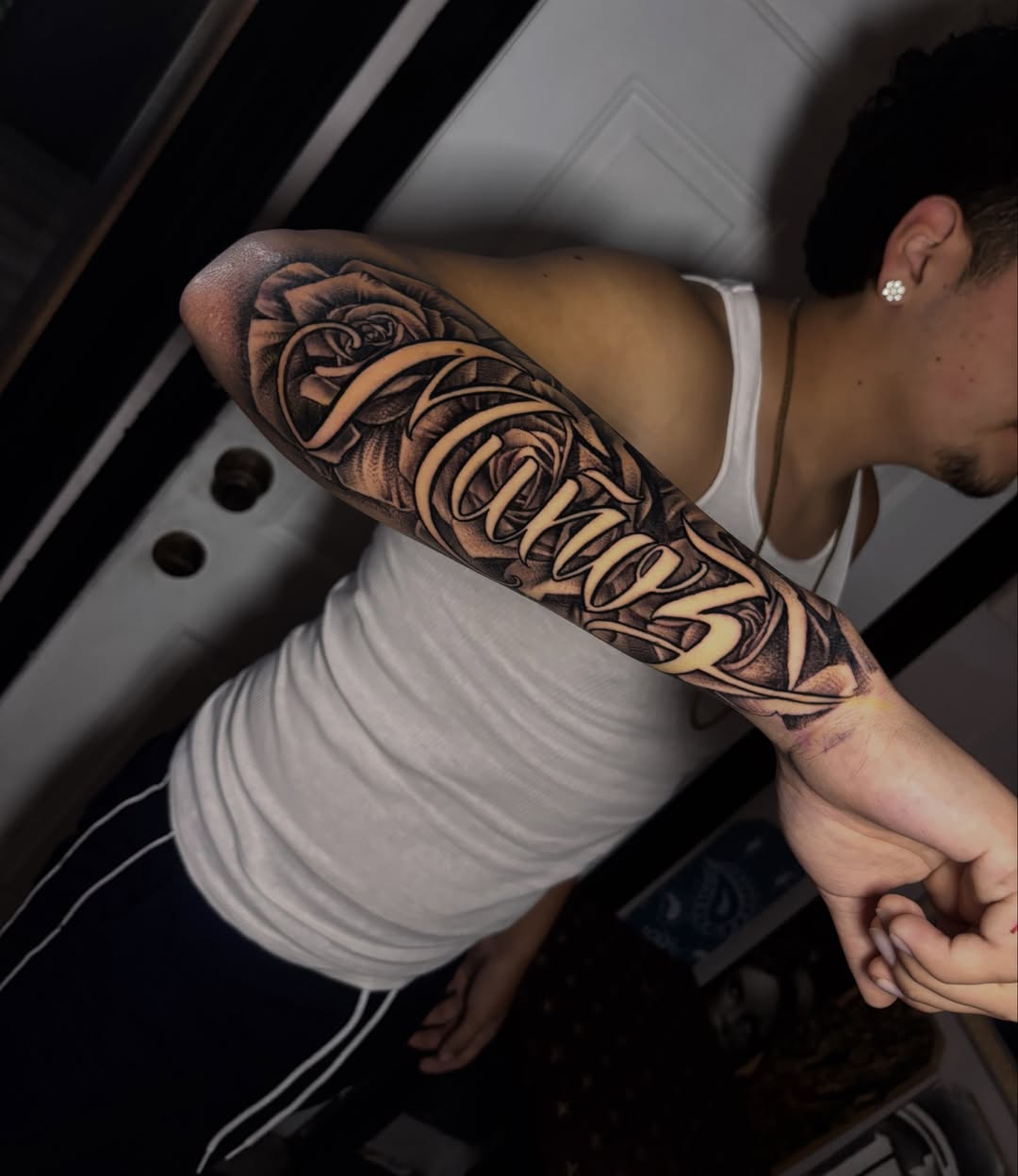 Rose and script realism tattoo on the forearm by michael