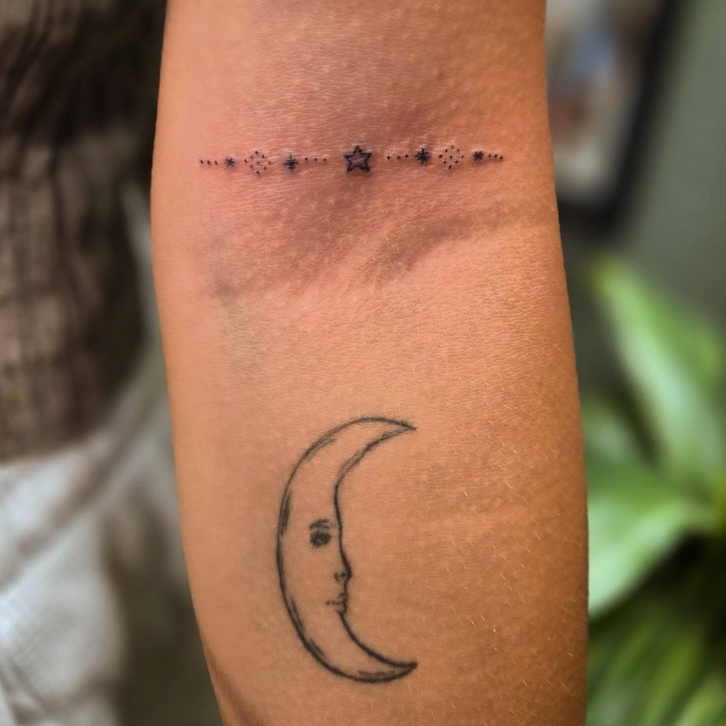 Moon dotwork tattoo on the forearm by Teresa Rose Tattoos
