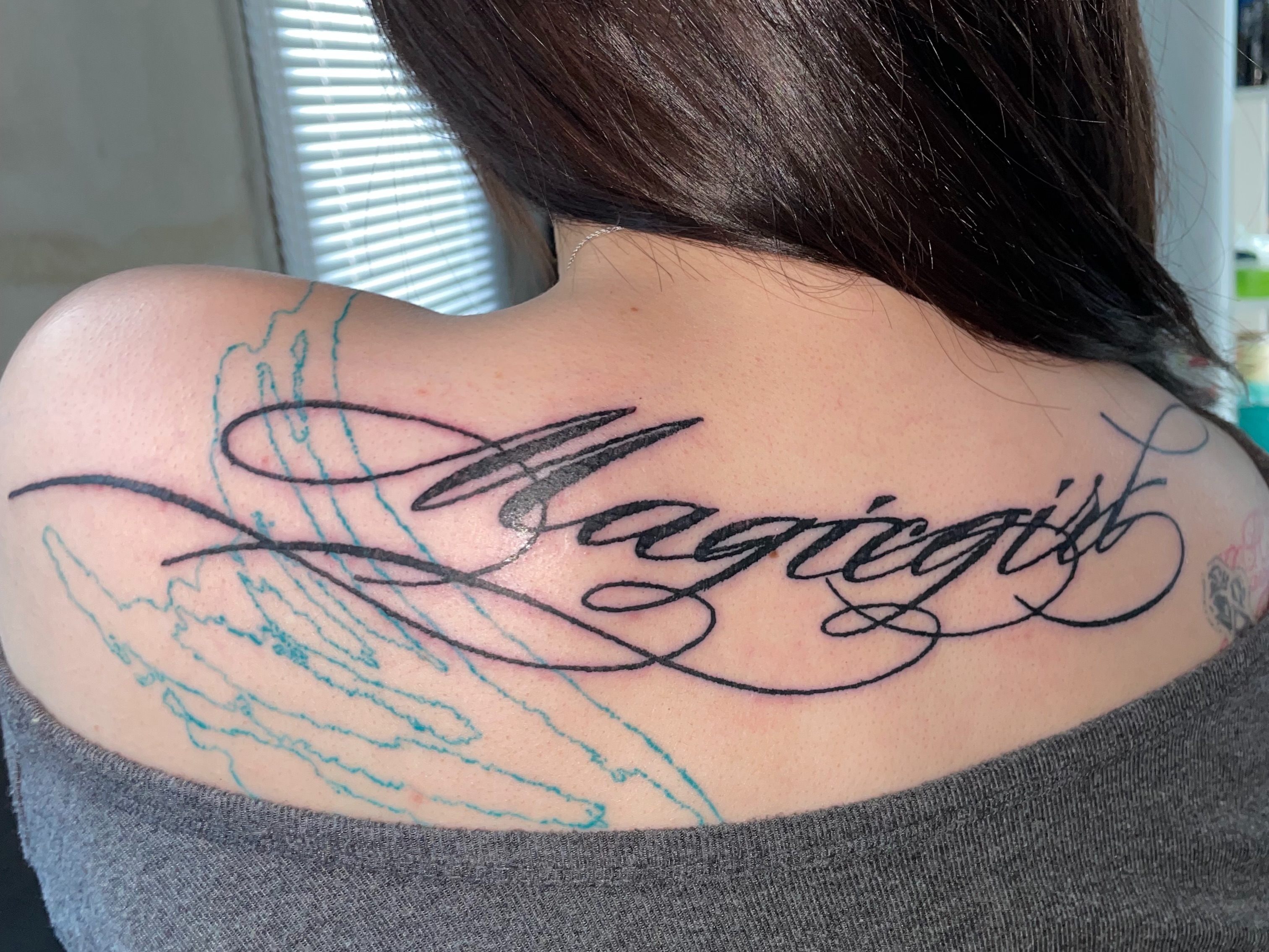Magicgirl lettering script tattoo on the shoulder by eyeball