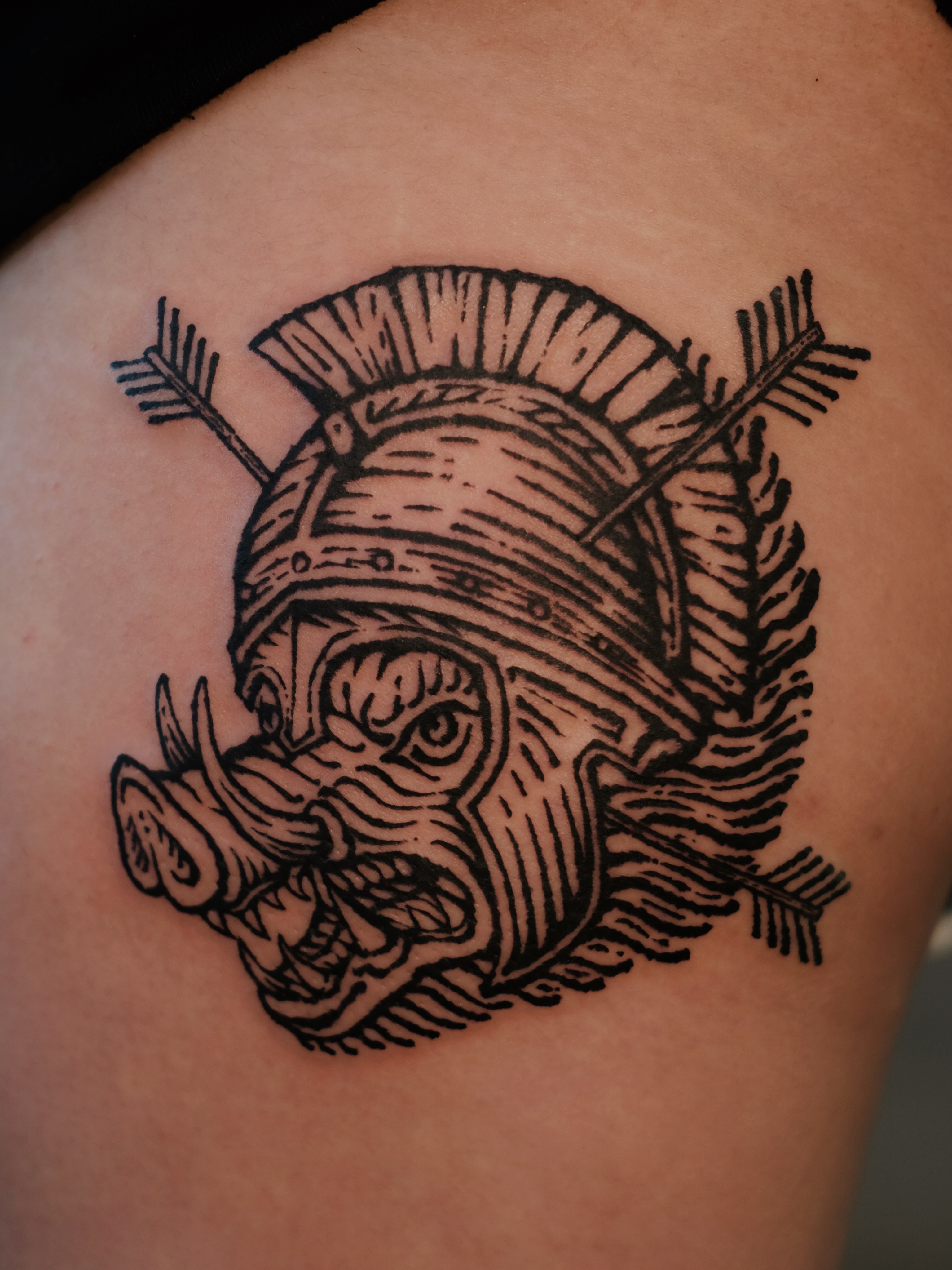 Boar head with helmet black and grey tattoo on the shoulder by ꜰʟᴏʀᴀ ᴡᴏᴏᴅᴄᴜᴛ ᴛᴀᴛᴛᴏᴏ
