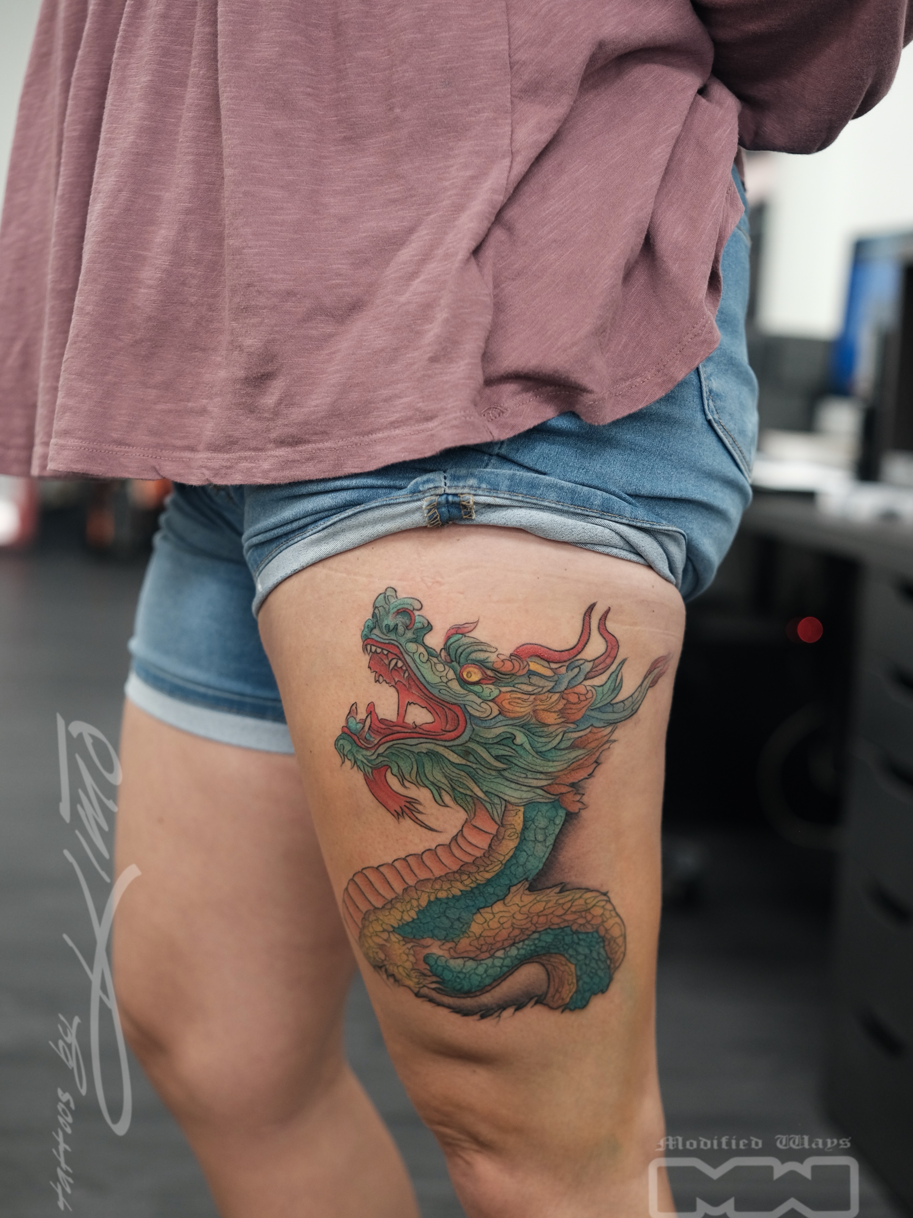Dragon new school tattoo on the thigh by Kansas City tattoo artist