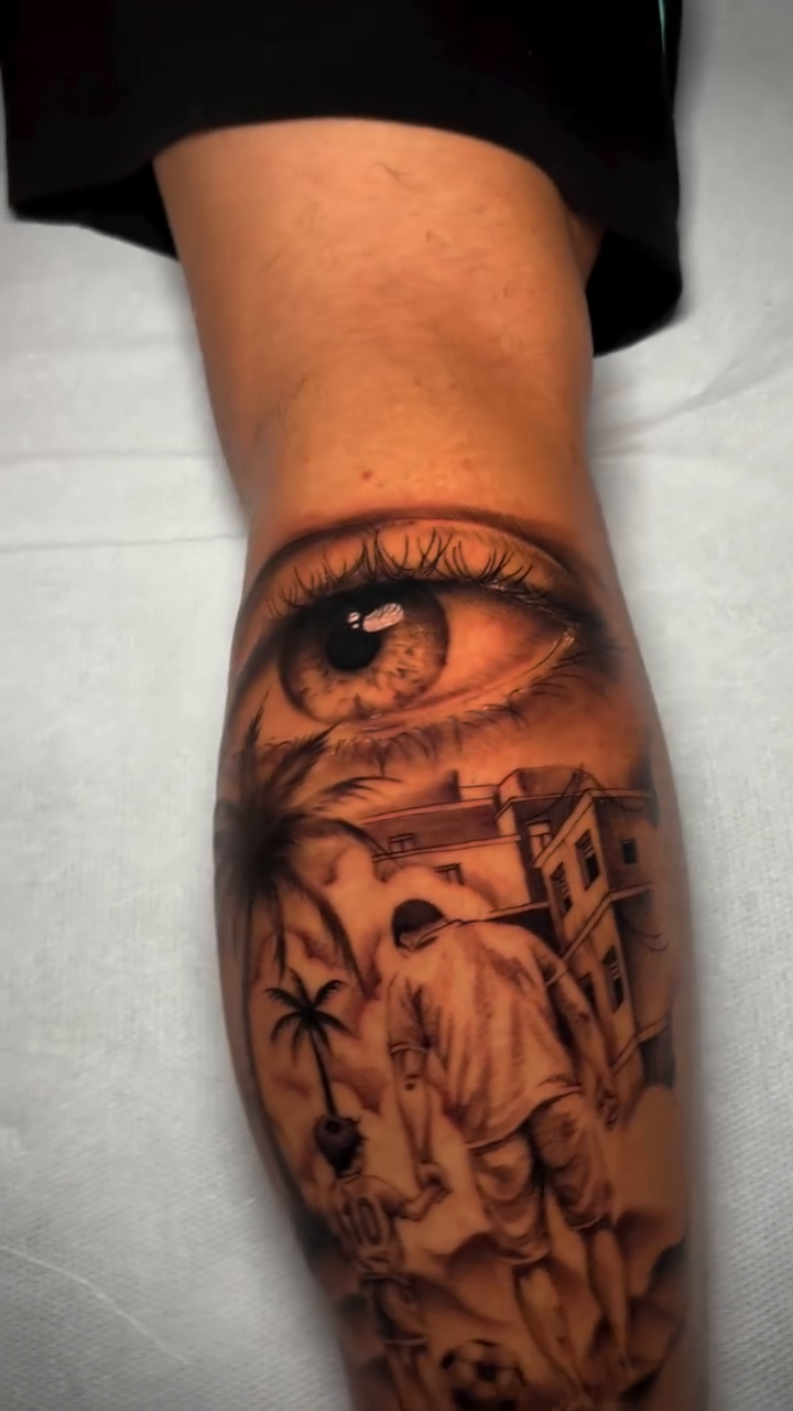 Eye with a surreal landscape realism tattoo by Blot_Tattoo