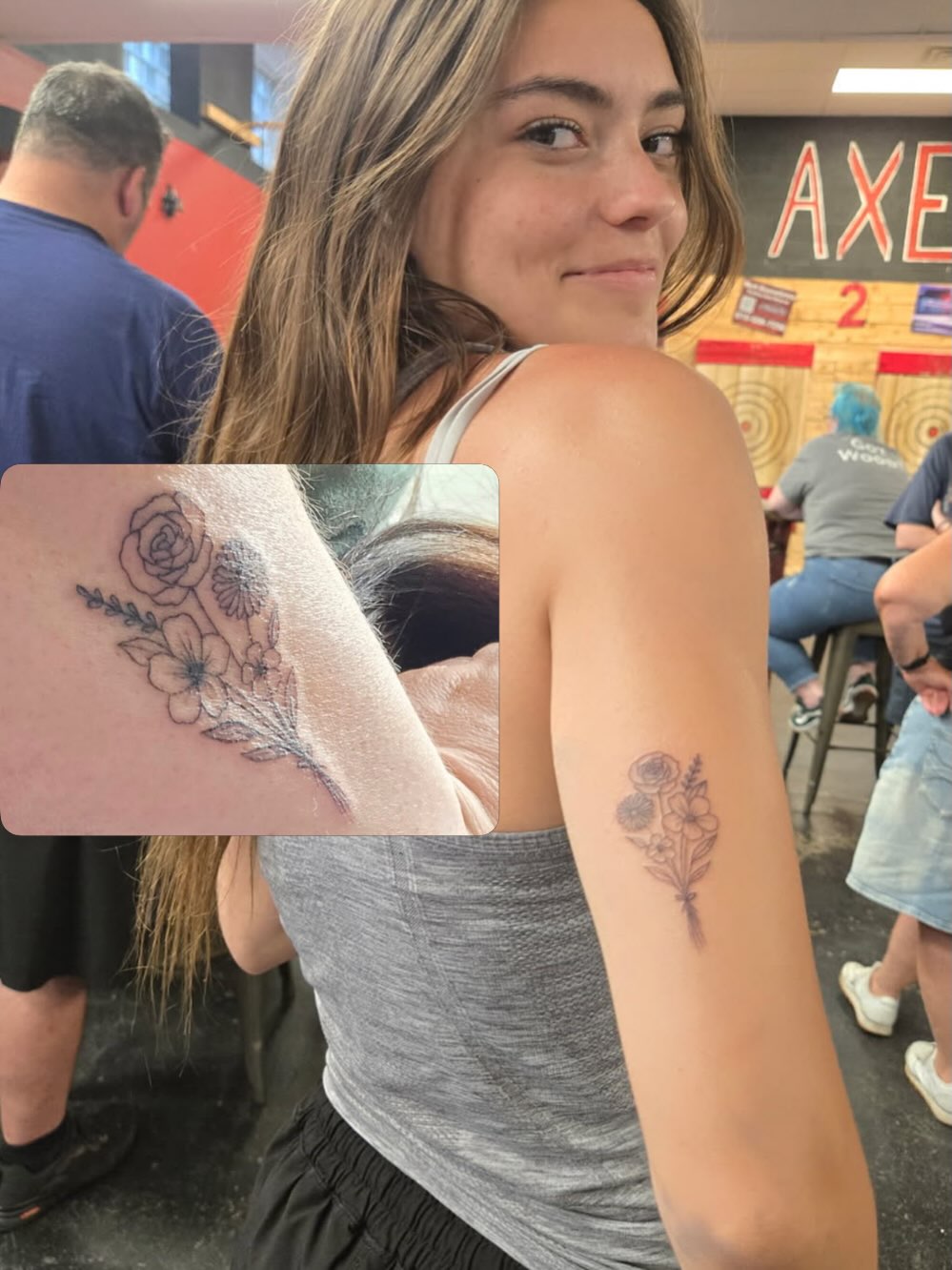 Floral bouquet black and grey tattoo on the upper arm by Malissa