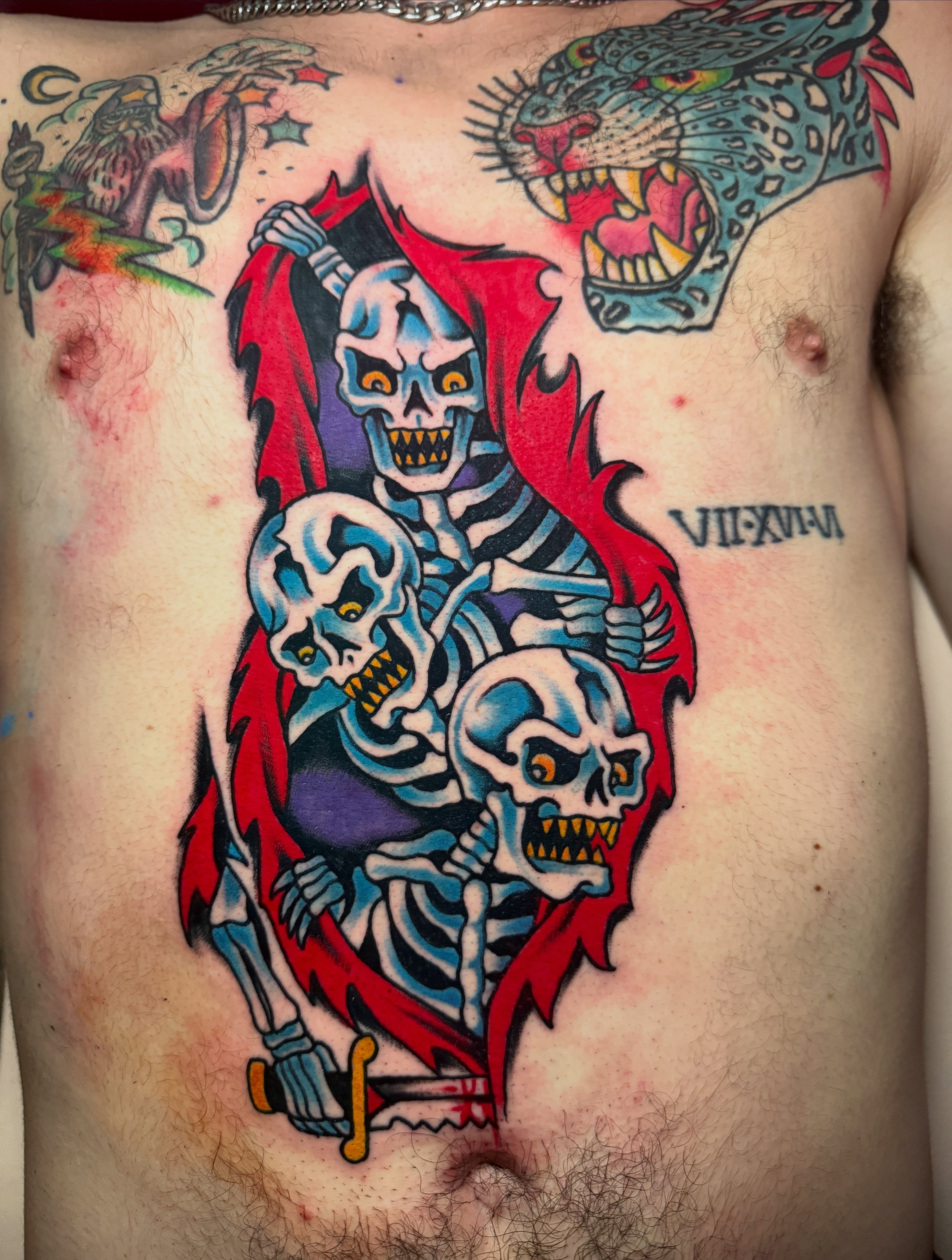 Skeletons American traditional tattoo on the chest by Angus Perfect, Philadelphia, Pennsylvania