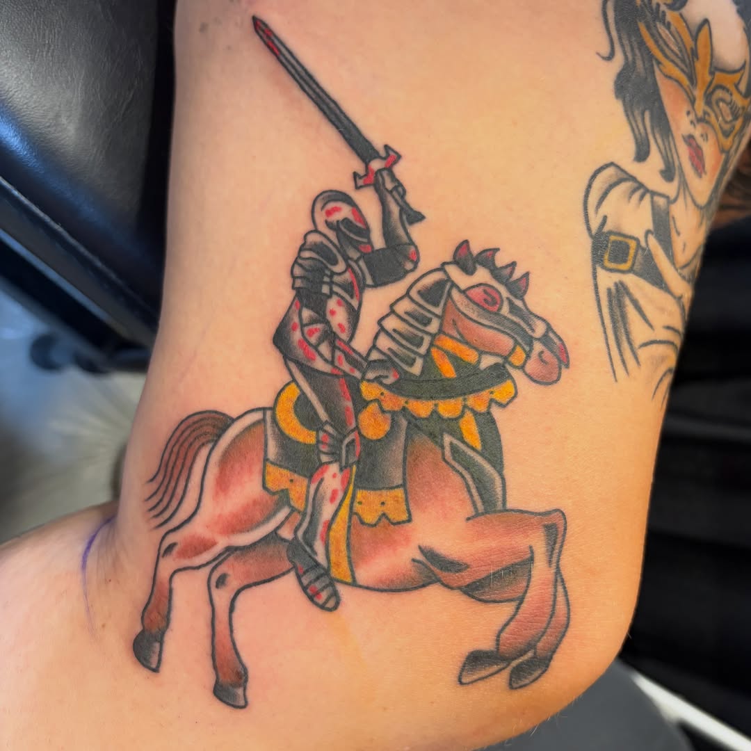 Knight on horseback American traditional tattoo on the forearm by Scrap Iron Tattoos