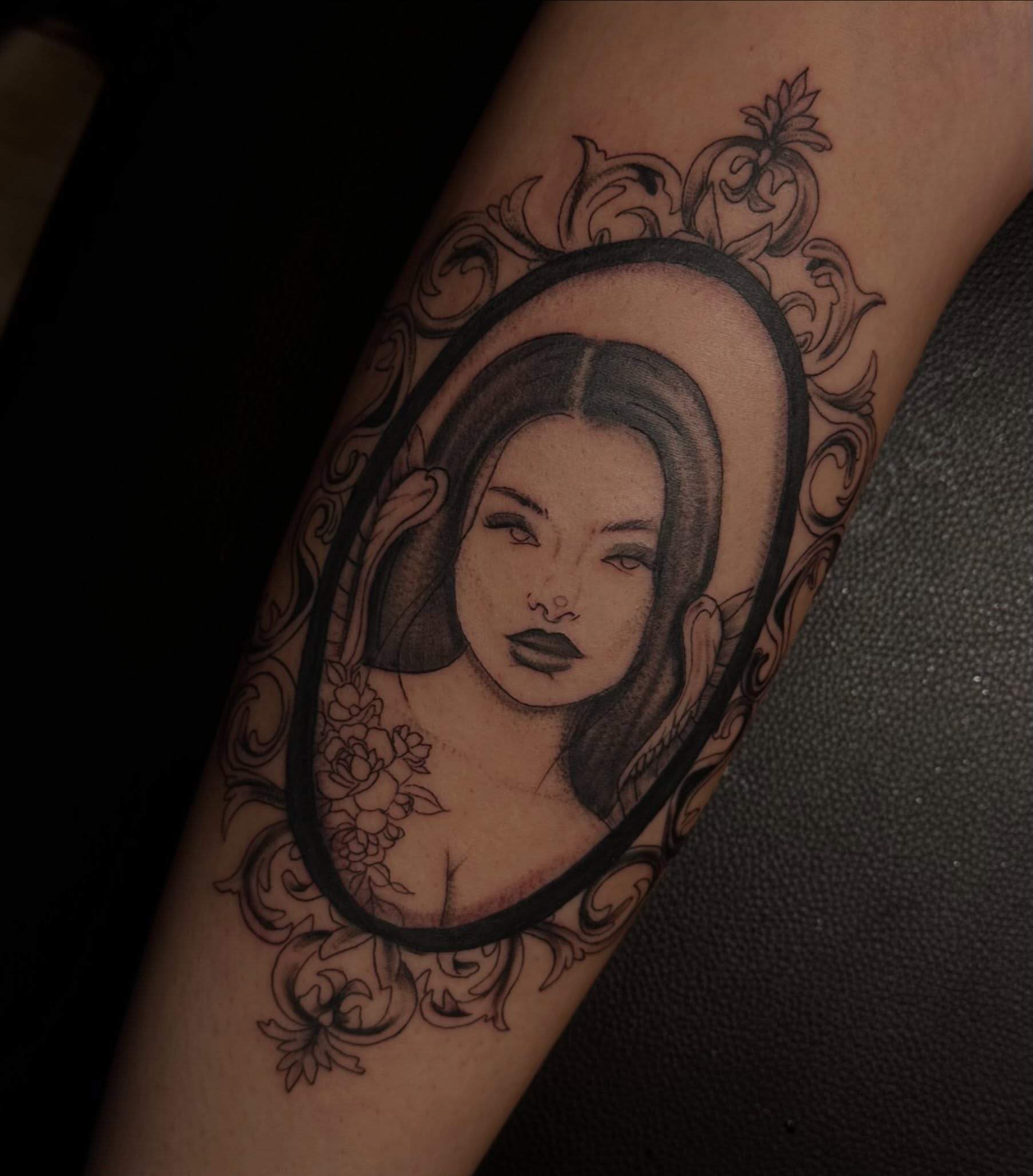 Portrait realism tattoo on the forearm by Marly Quinn