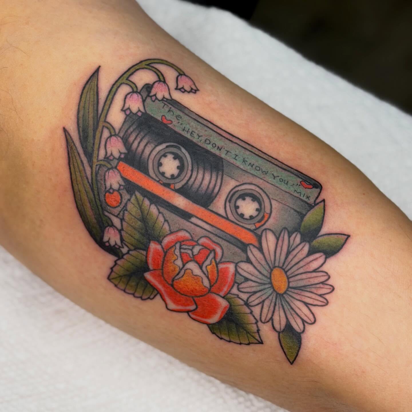 Cassette tape with flowers American traditional tattoo on the forearm by Jenna Szerszen-Wynn ๐
