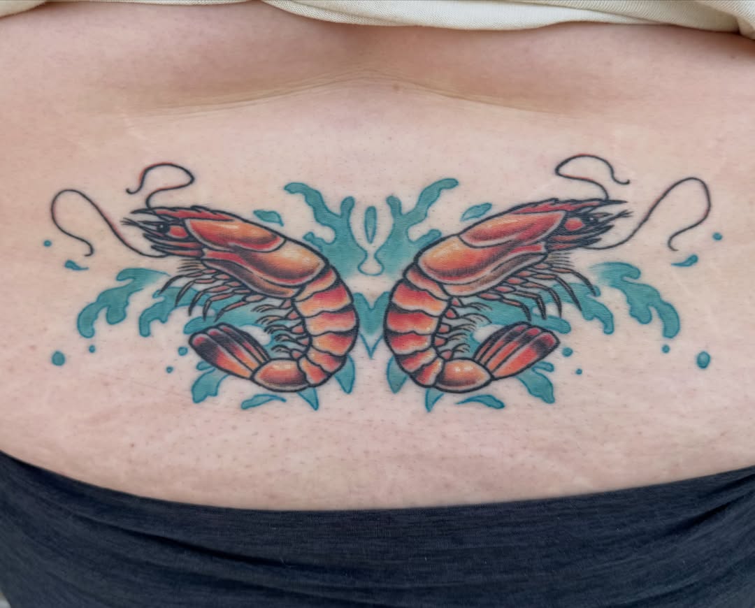 Prawns realism tattoo on the torso by Nikki Powills