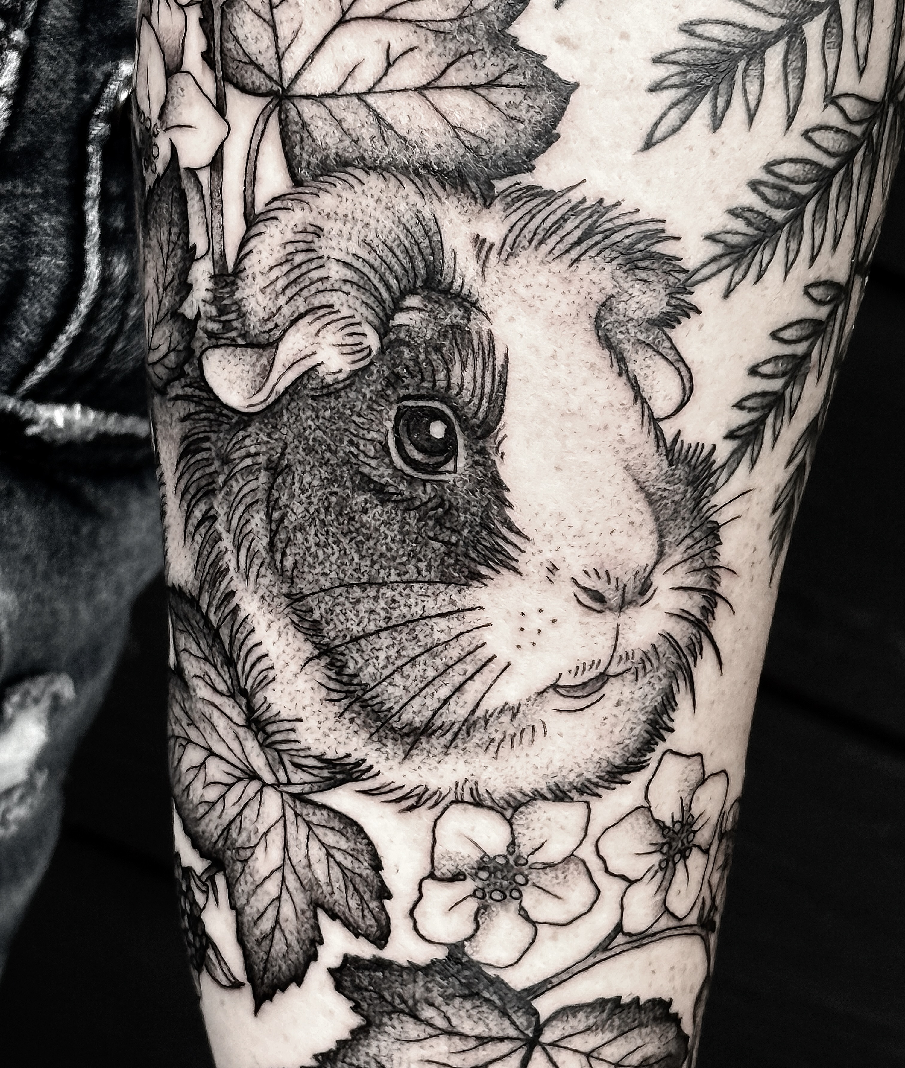 Guinea pig dotwork tattoo on the forearm by Breezy Tucker