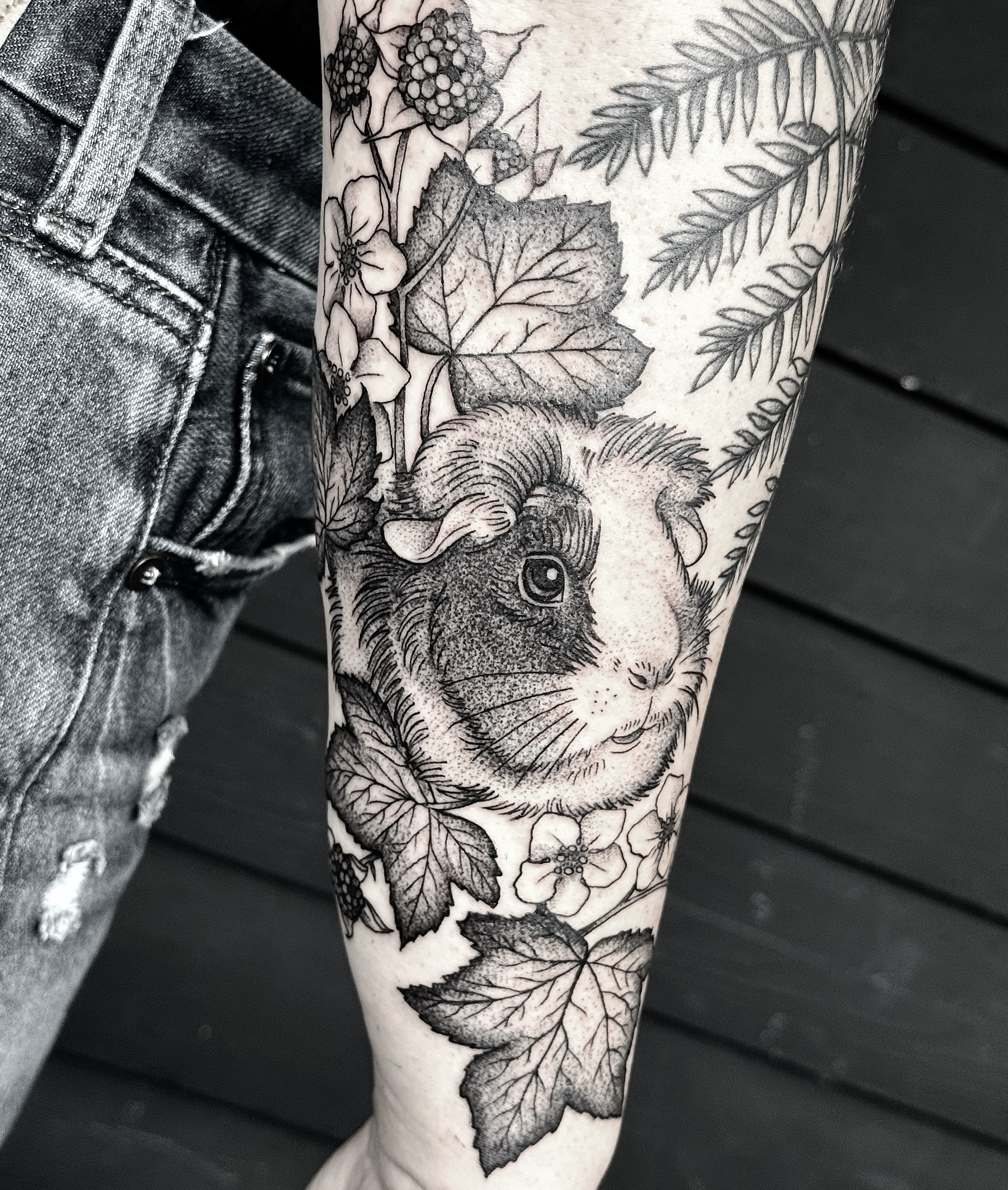 Guinea pig realism tattoo on the forearm by Breezy Tucker