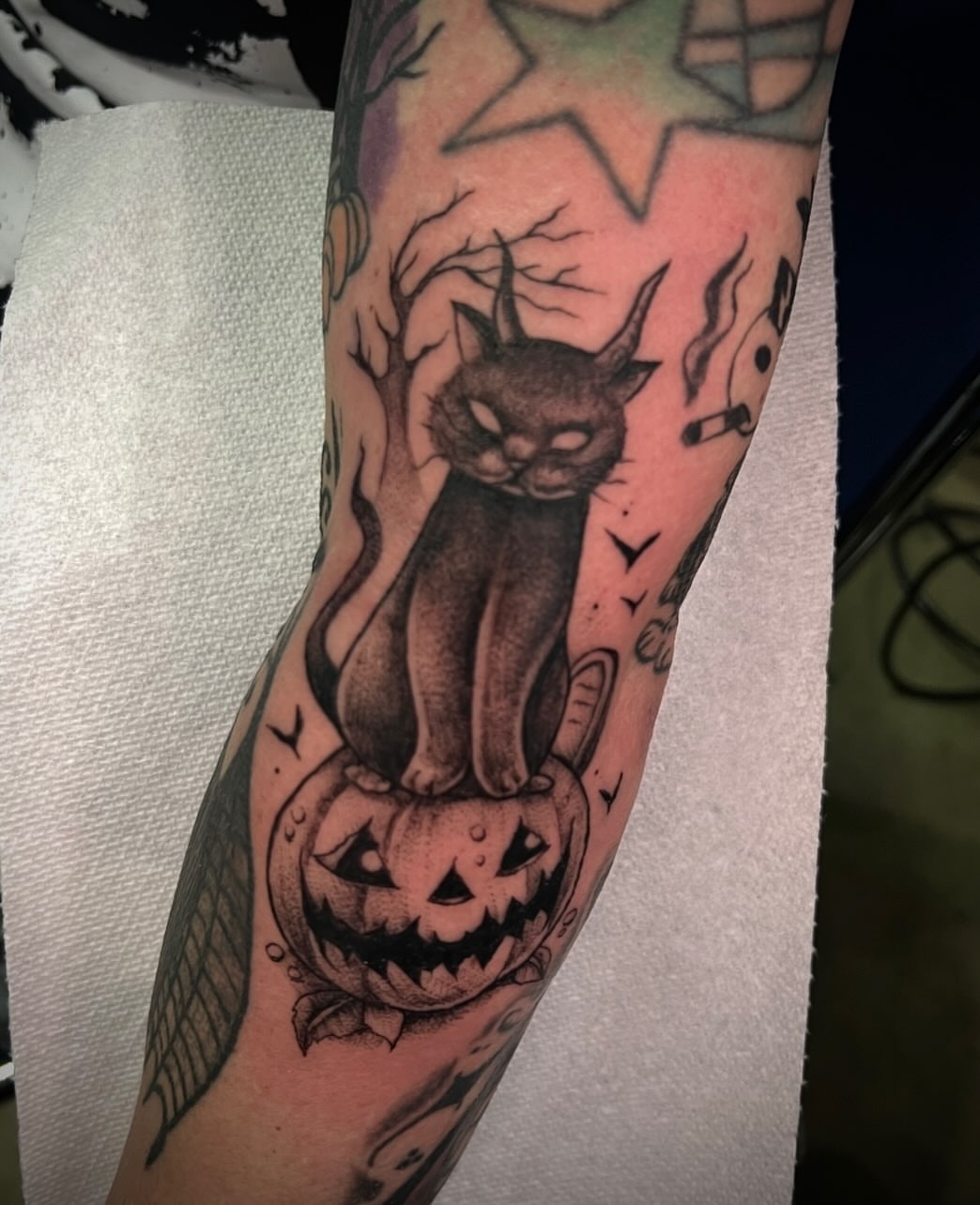 Cat and jack-o'-lantern American traditional tattoo on the forearm by π·ππ πππππ π·οΈ
