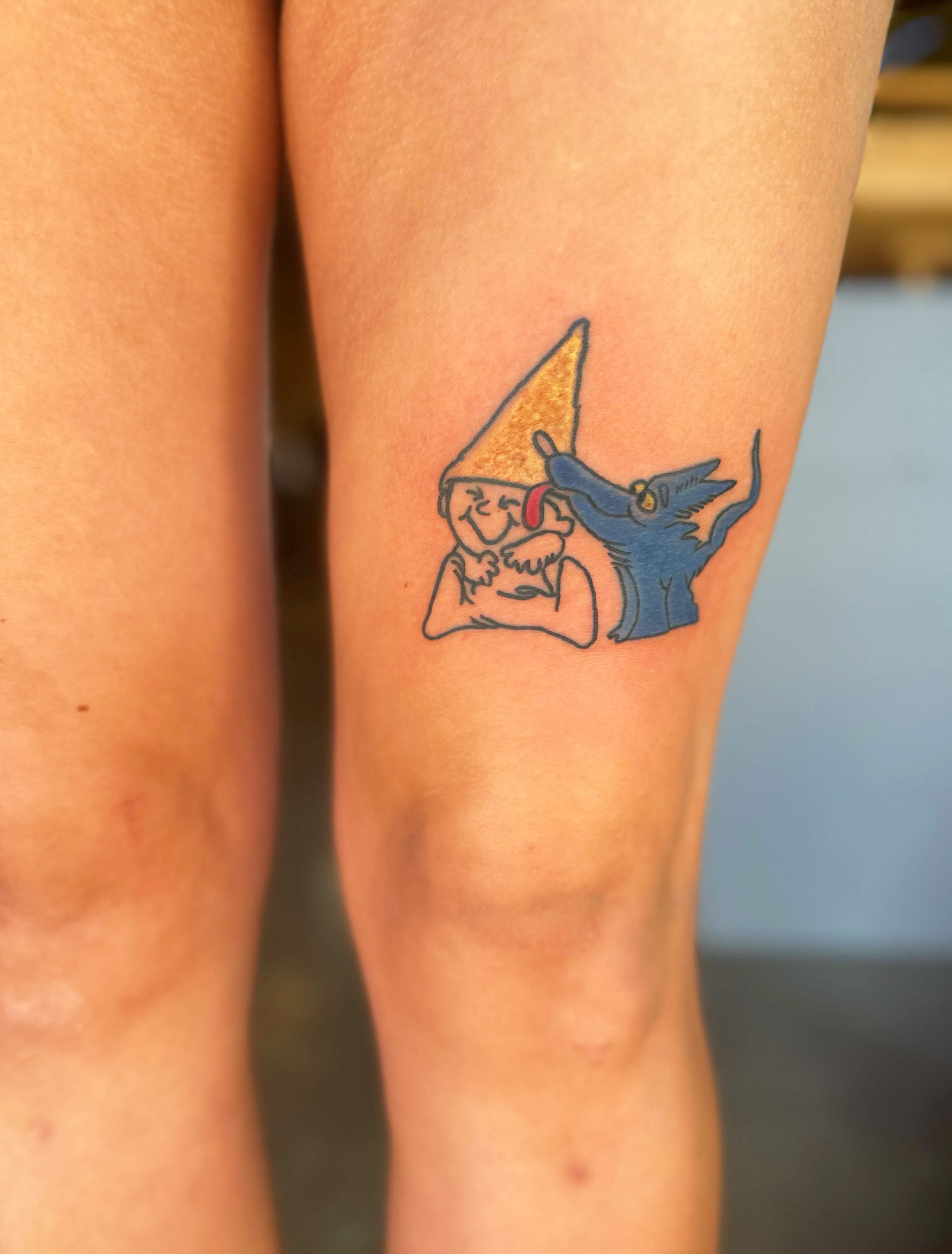 Gnome and blue creature dotwork tattoo on the thigh by Madeline Seeley
