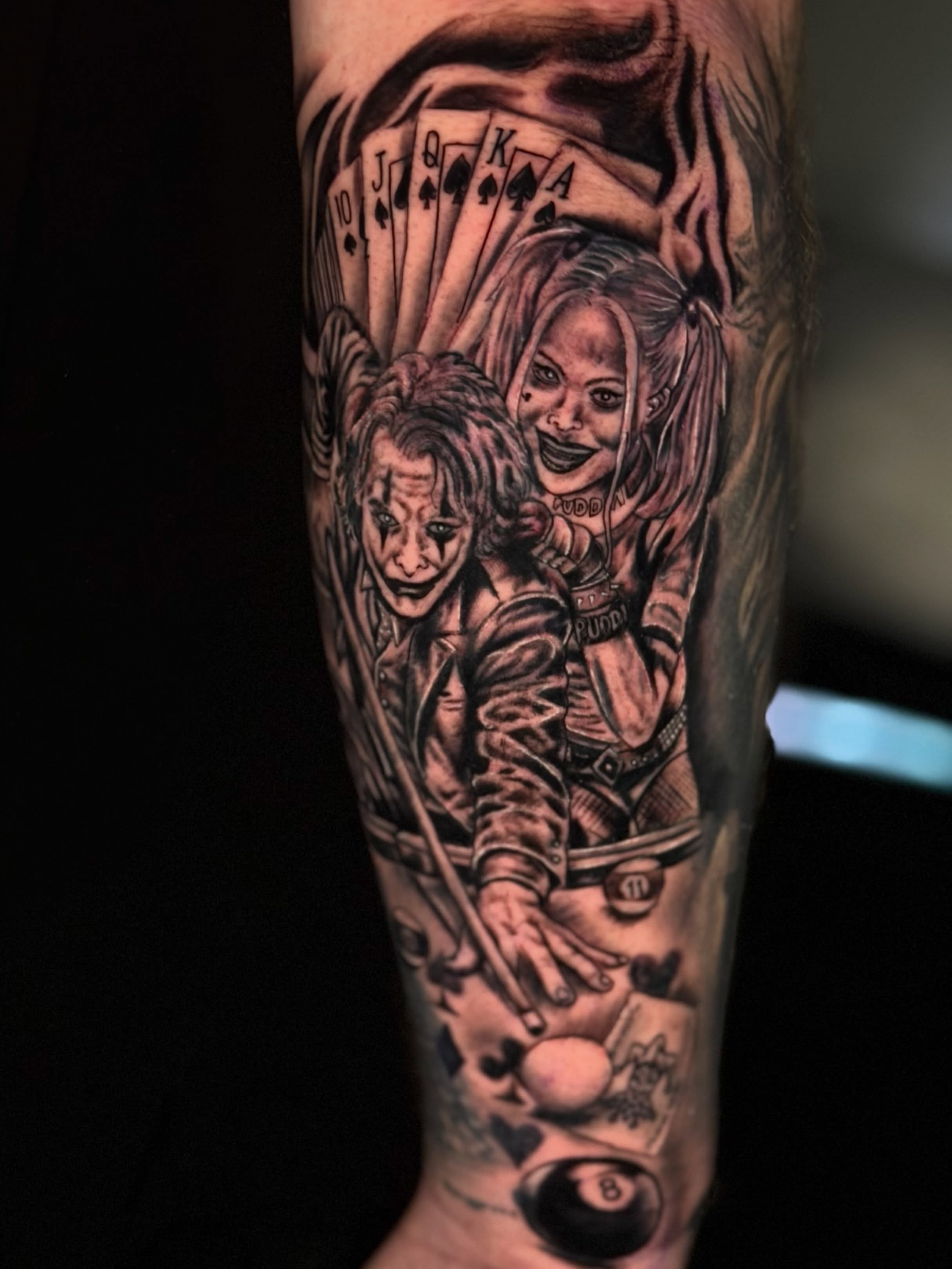 Joker and harley quinn realism tattoo on the forearm by Dany