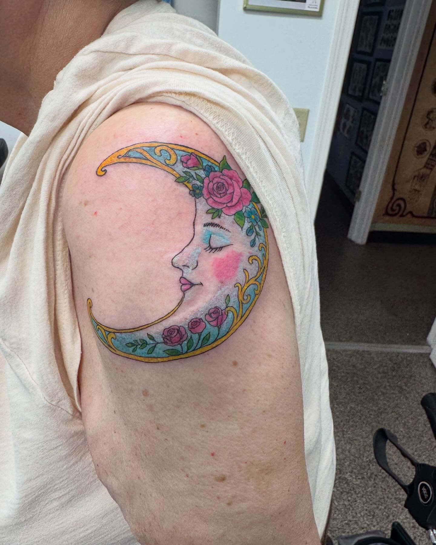 Moon with face illustrative tattoo on the shoulder by Brazun Locker Poloschan