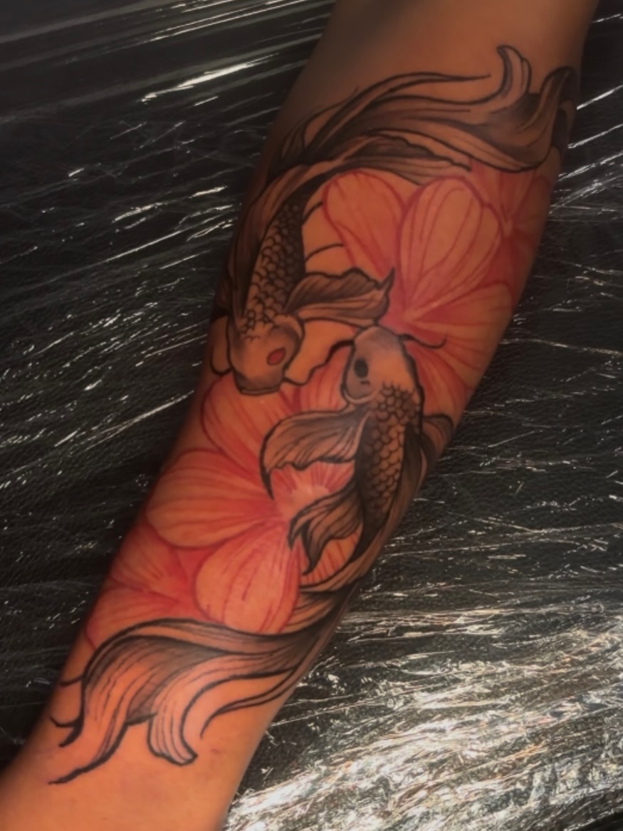 Koi fish and lotus flower japanese irezumi tattoo on the forearm by Female Cleveland Tat Artist ๐