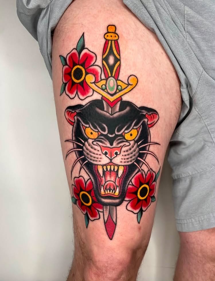 Panther and dagger American traditional tattoo on the thigh by Vivian HavaTattoo, Richmond, Virginia