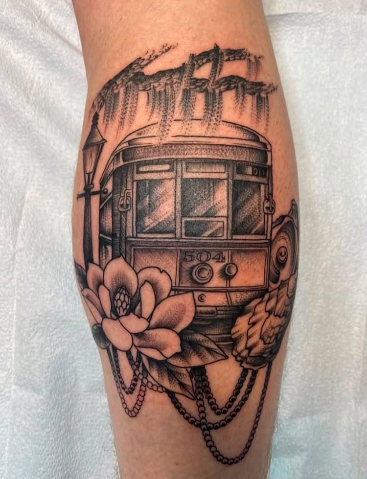 Streetcar and magnolia realism tattoo on the forearm by Vivian HavaTattoo, Richmond, Virginia