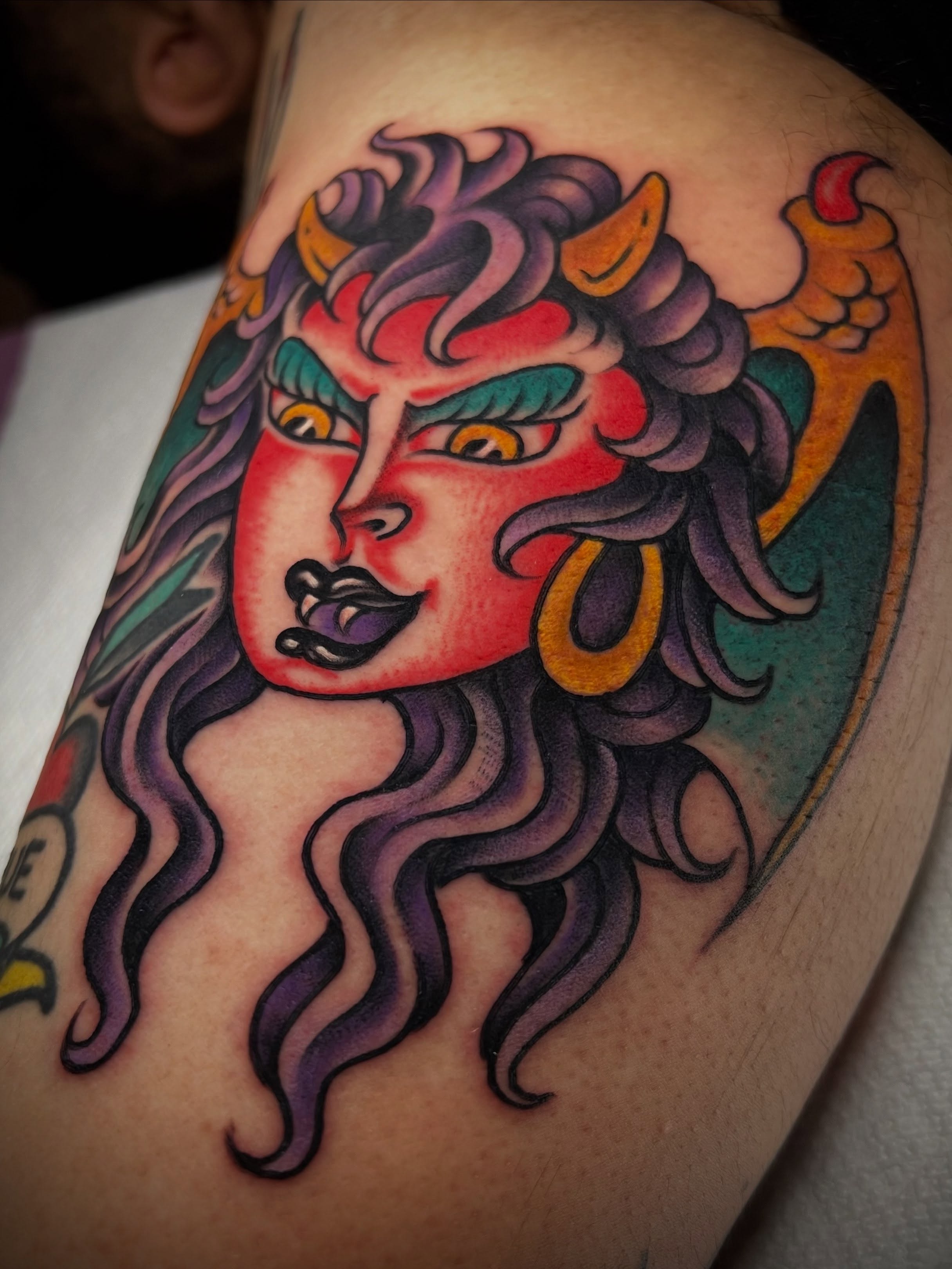 Woman with horns American traditional tattoo on the shoulder by ᴍᴀᴛᴛ ᴀʟᴇxᴀɴᴅᴇʀ