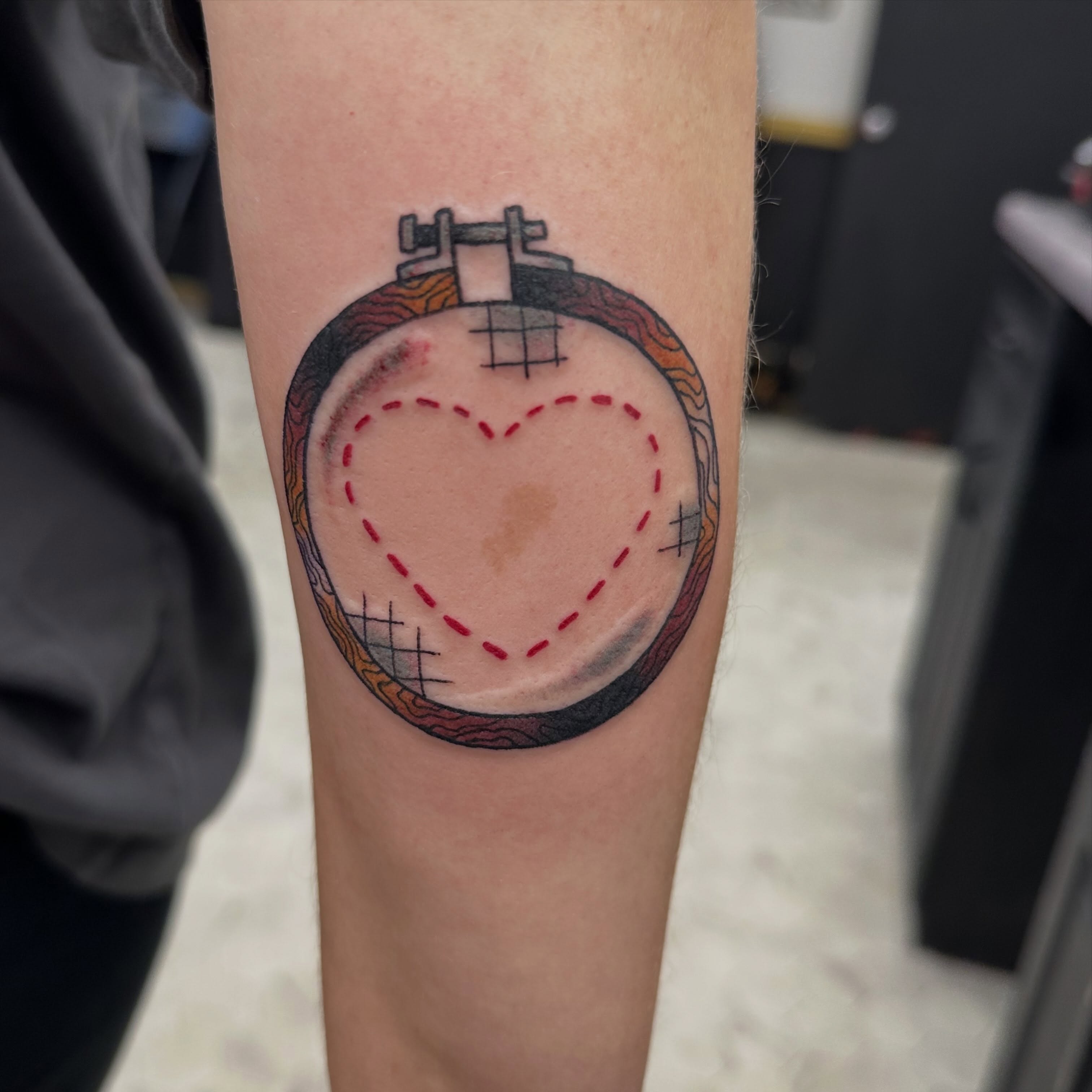 Heart geometric tattoo on the forearm by Nicki Hoverson