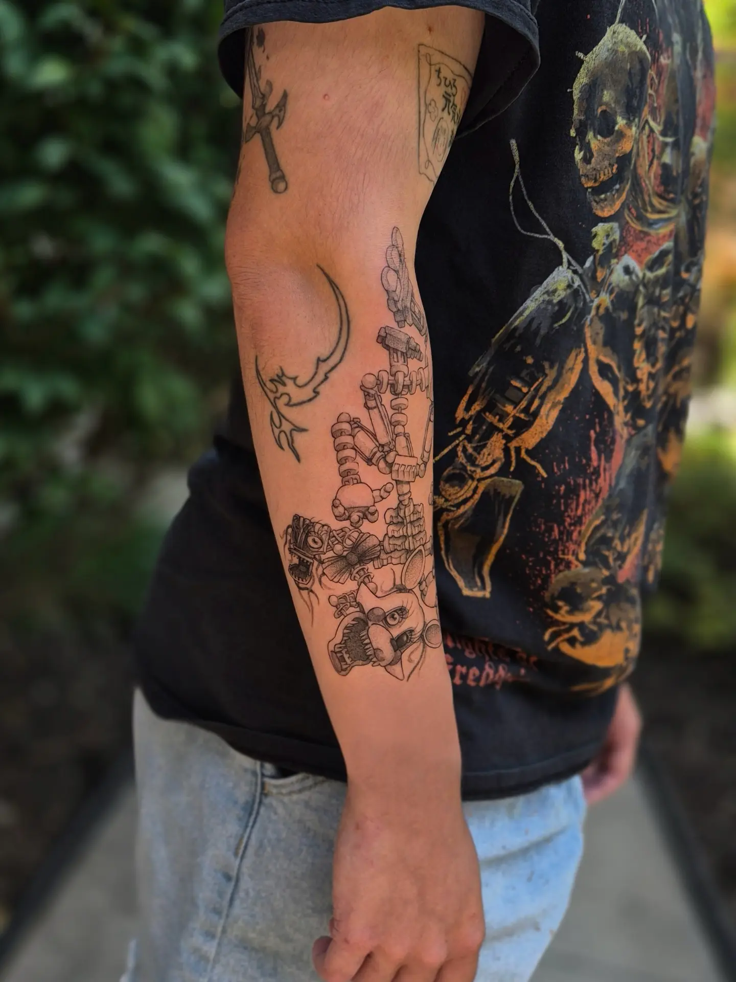 Skeleton and mechanical parts black and grey tattoo on the forearm by Sophorn Long (soapy)