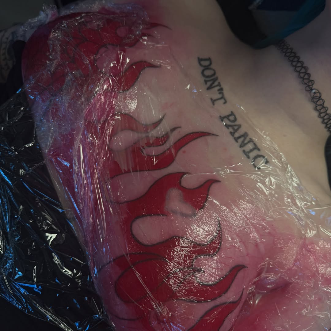 Flames American traditional tattoo on the chest by Kait