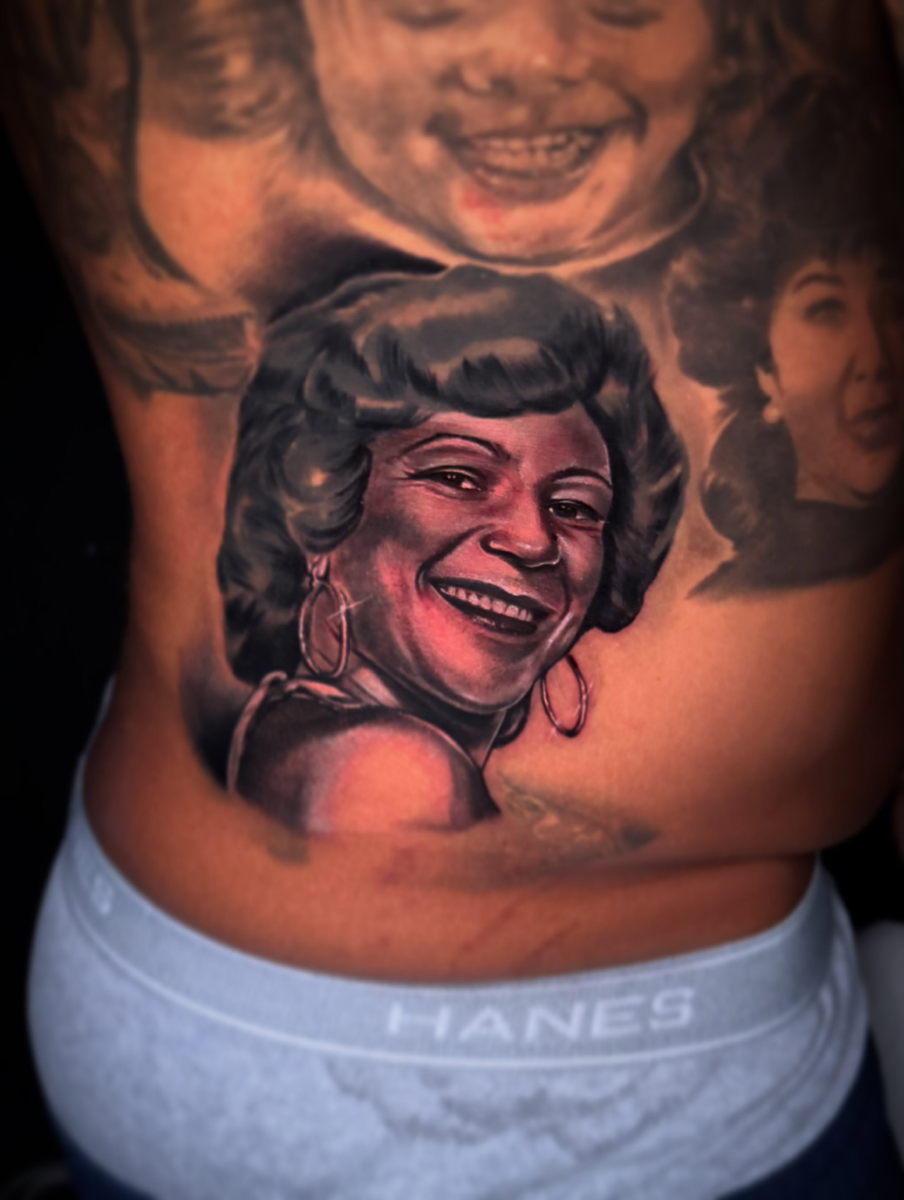Portrait realism tattoo on the torso by Eric Zuluaga