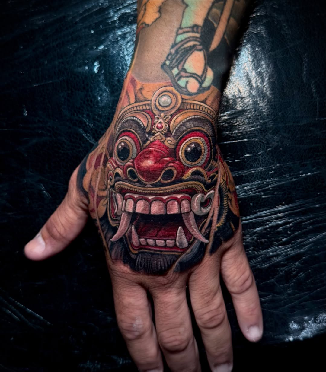 Barong mask realism tattoo on the hand by Matt Vaught π Dark Surrealism