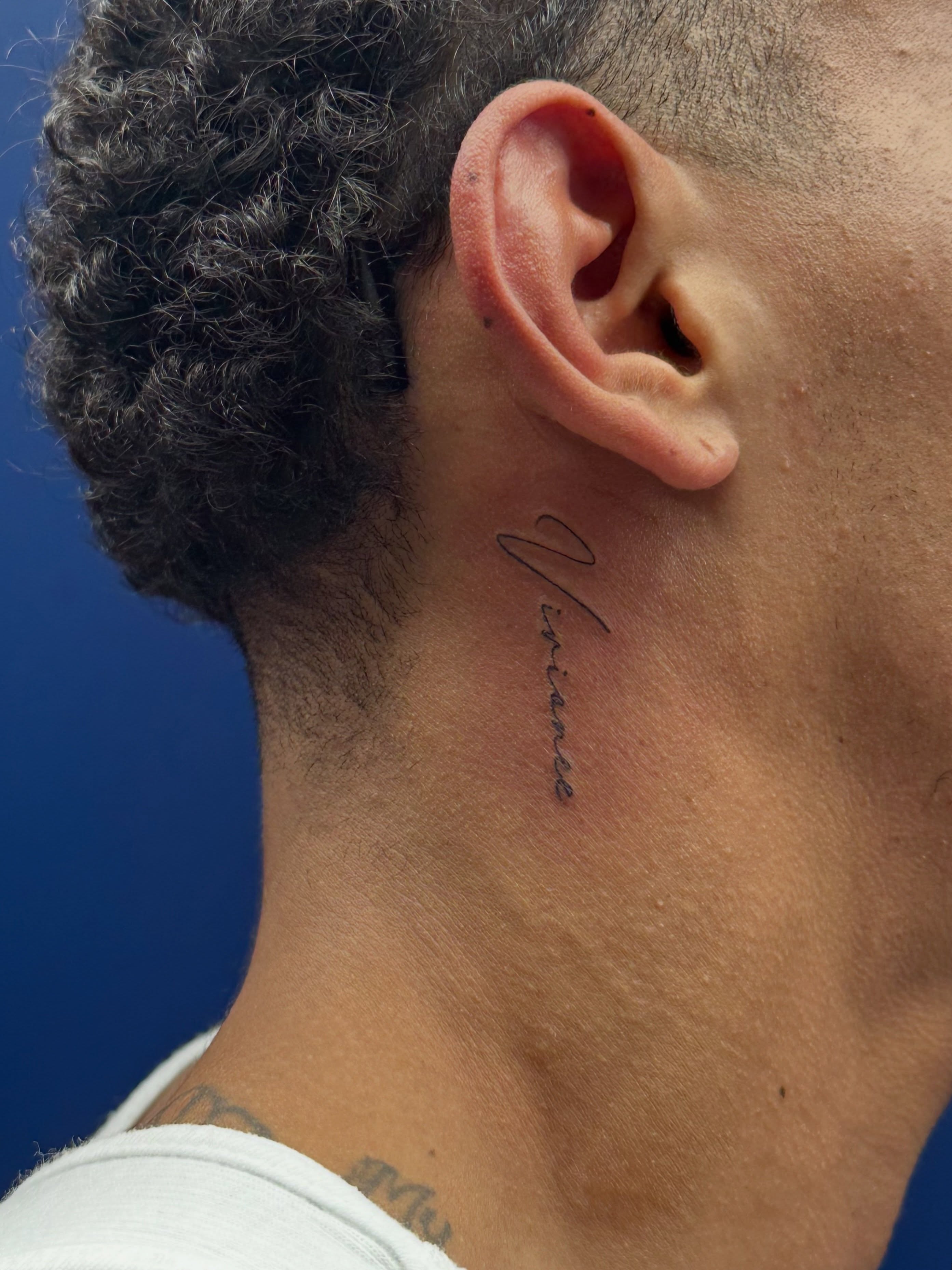 Script lettering lettering script tattoo on the neck by Tattoo Takayo