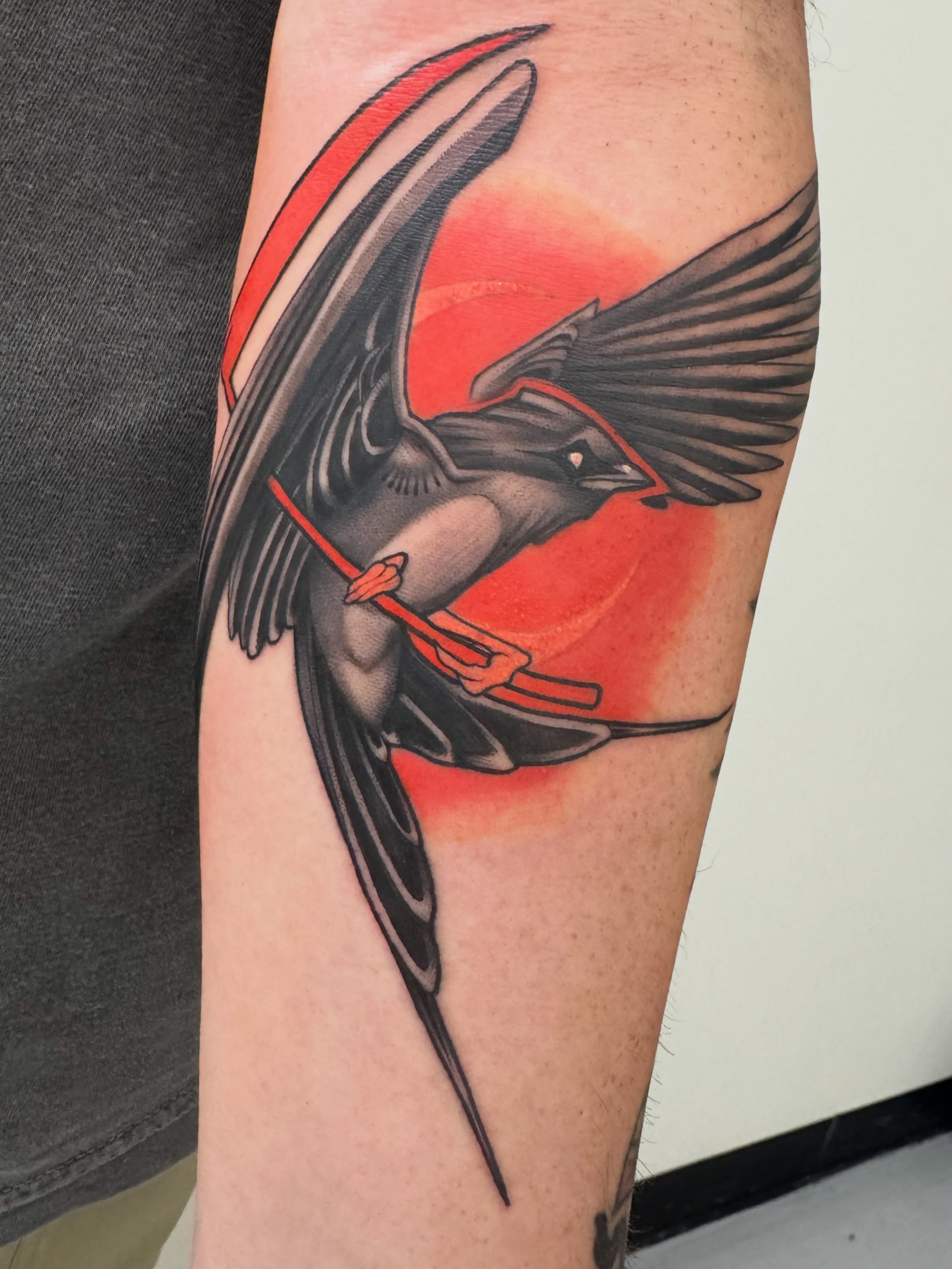 Swallow American traditional tattoo on the forearm by Jaxx Kesler