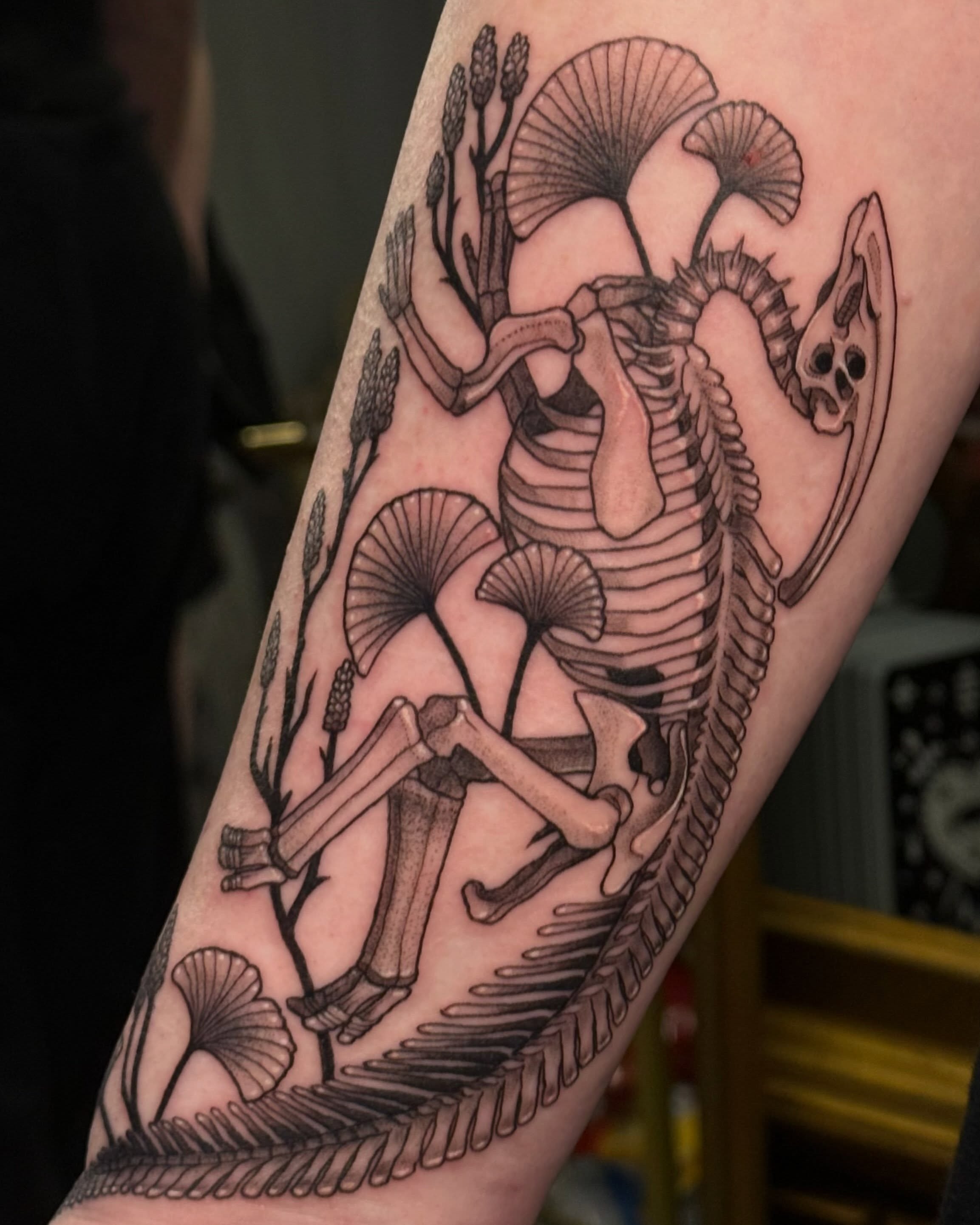 Skeleton and mushrooms realism tattoo on the forearm by Christian