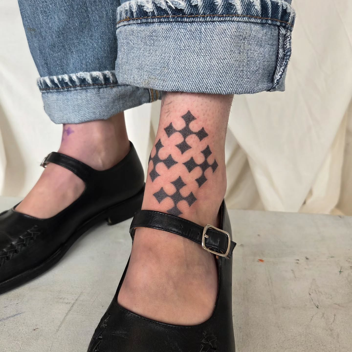 Crosses dotwork tattoo on the calf by jules tattoos