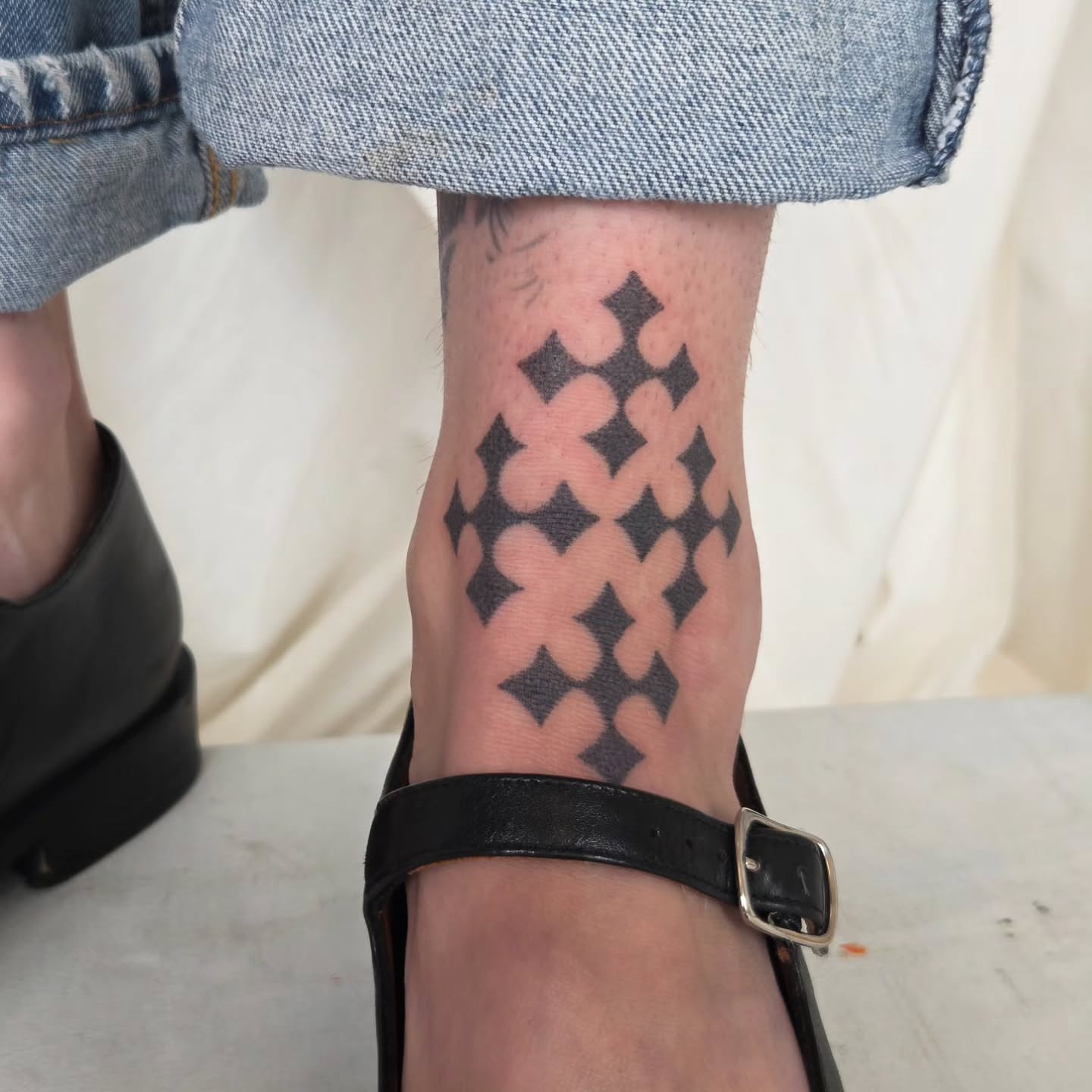Crosses geometric tattoo on the calf by jules tattoos