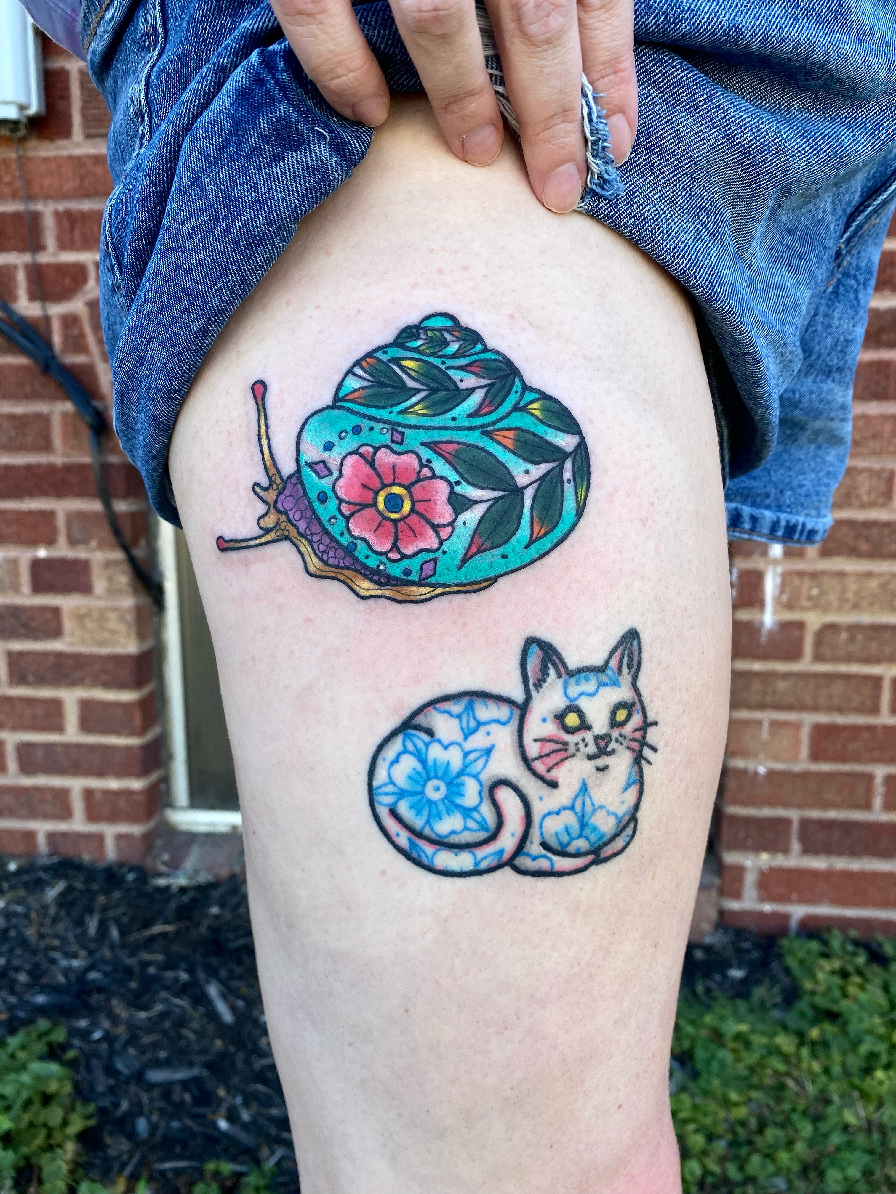 Snail and cat watercolor tattoo on the thigh by Sheila Asbury 💲