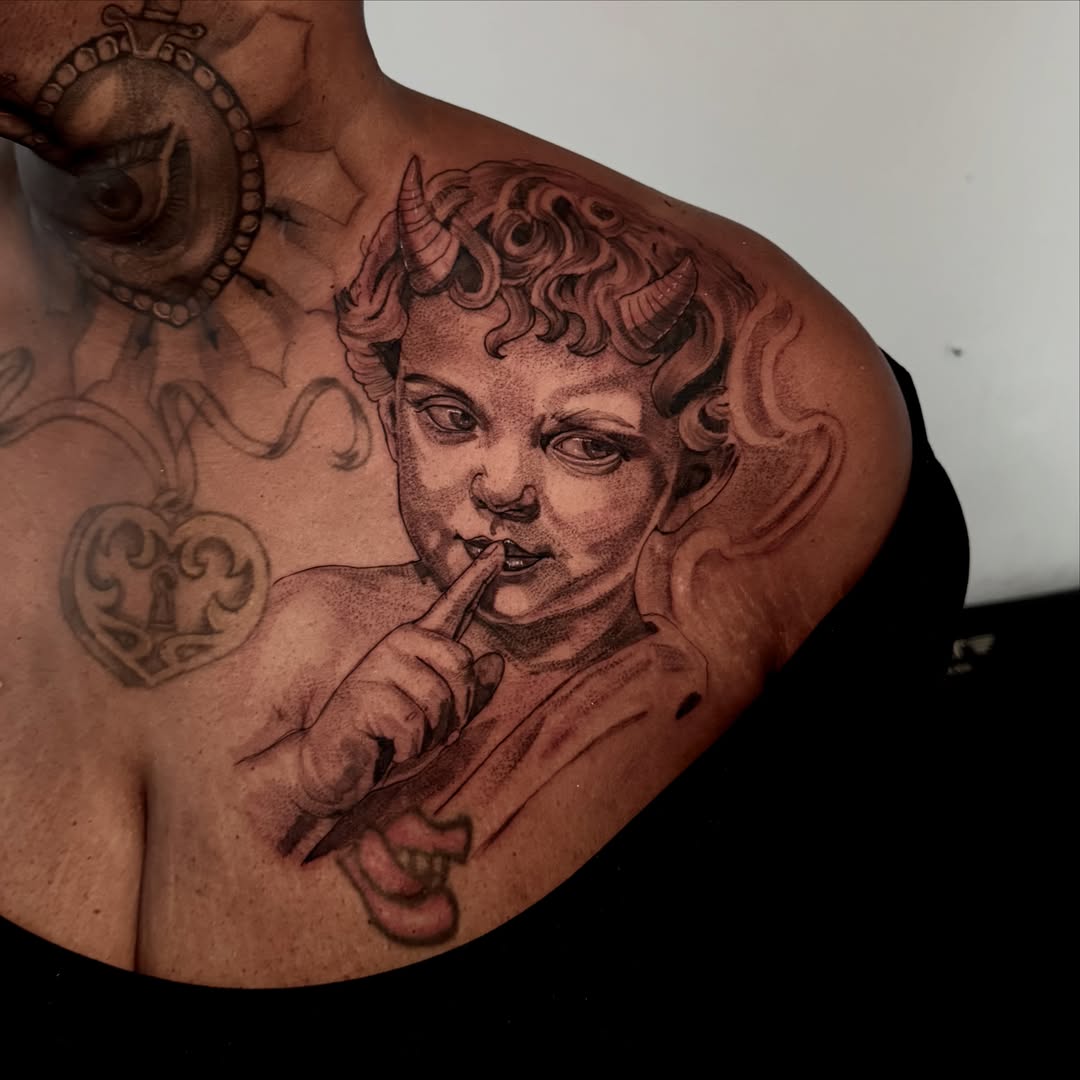 Child with horns realism tattoo on the chest by Tattoo Artist