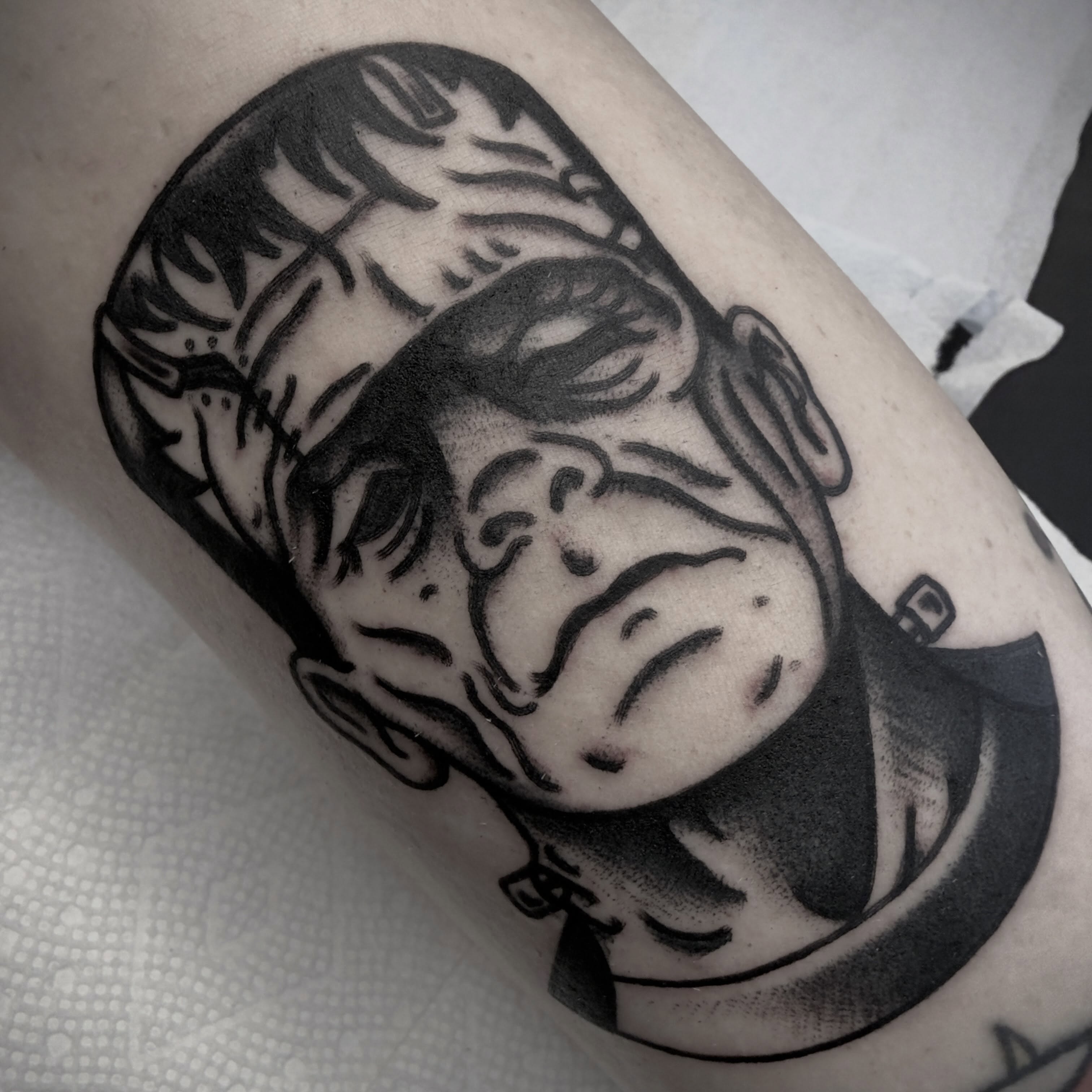Astronaut helmet dotwork tattoo on the forearm by Andrew Slater
