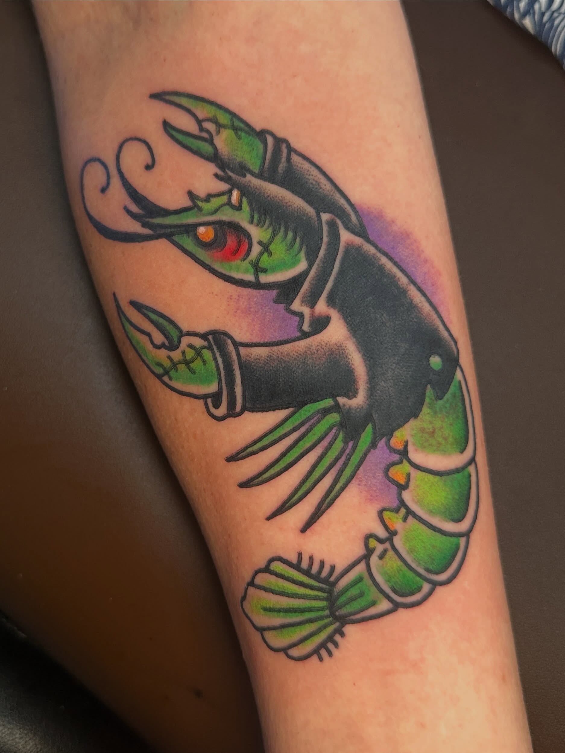 Lobster American traditional tattoo on the forearm by Stacey Colangelo