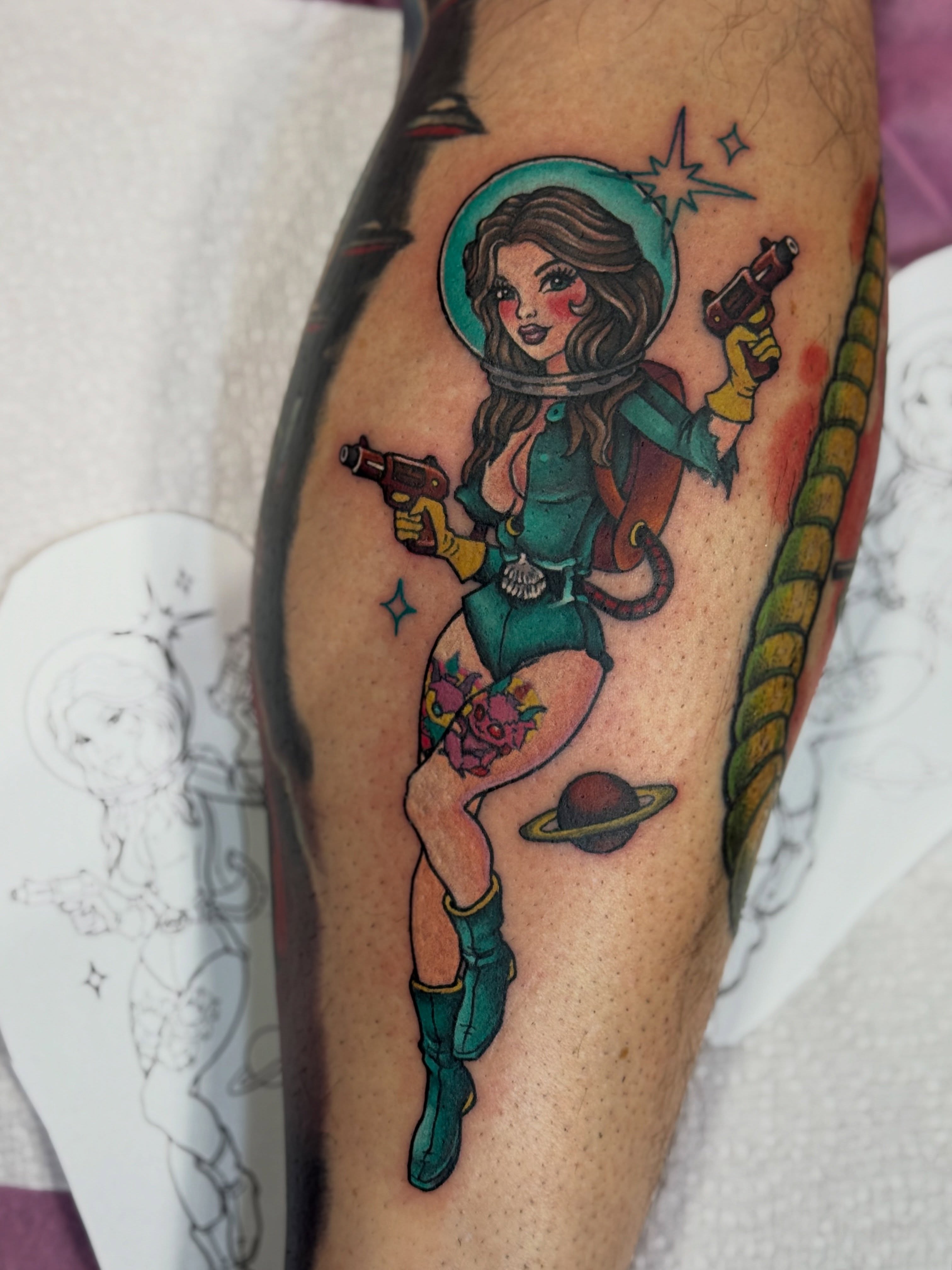 Cosmic pin-up girl new school tattoo on the forearm by Alexandra Fische