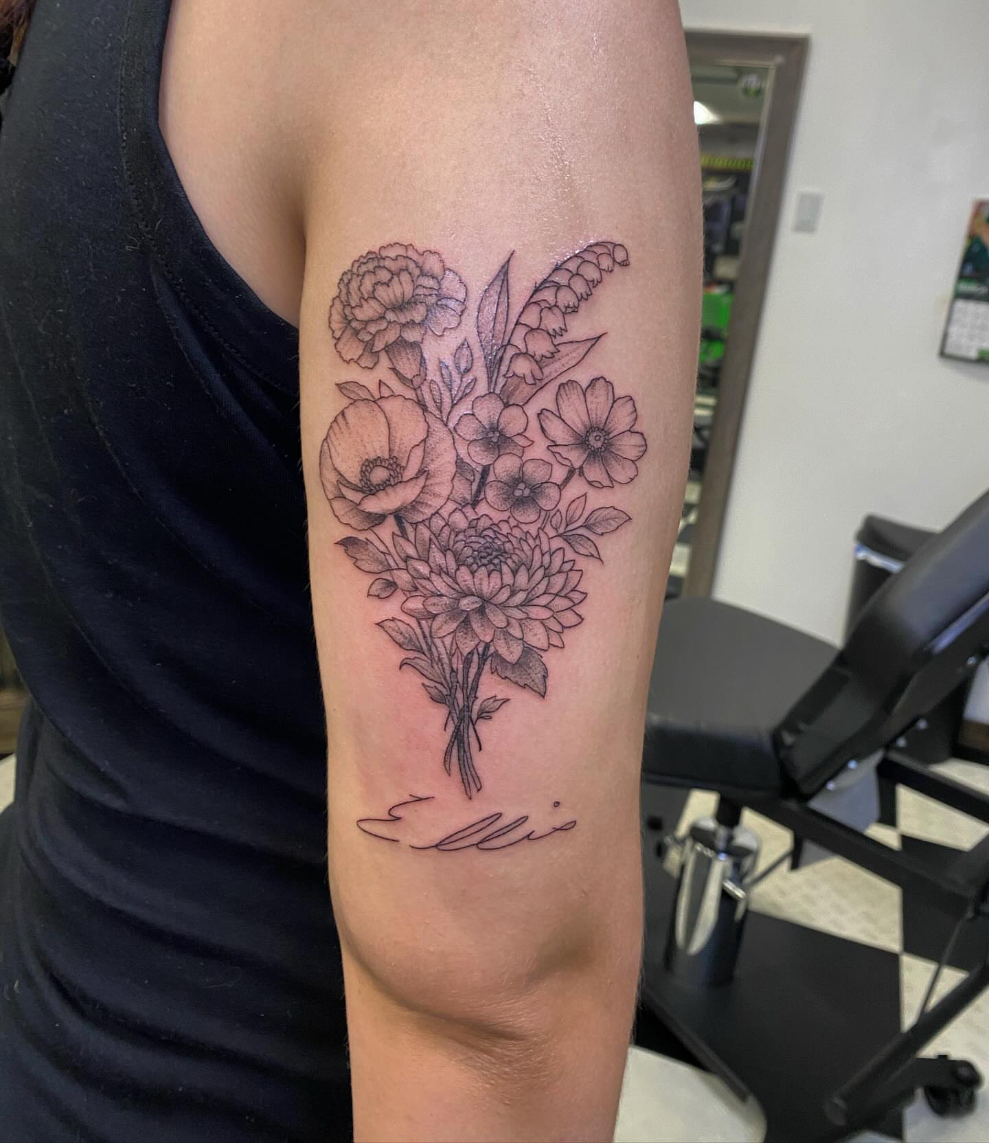 Flower bouquet black and grey tattoo on the forearm by Spencer Jones Tattoos