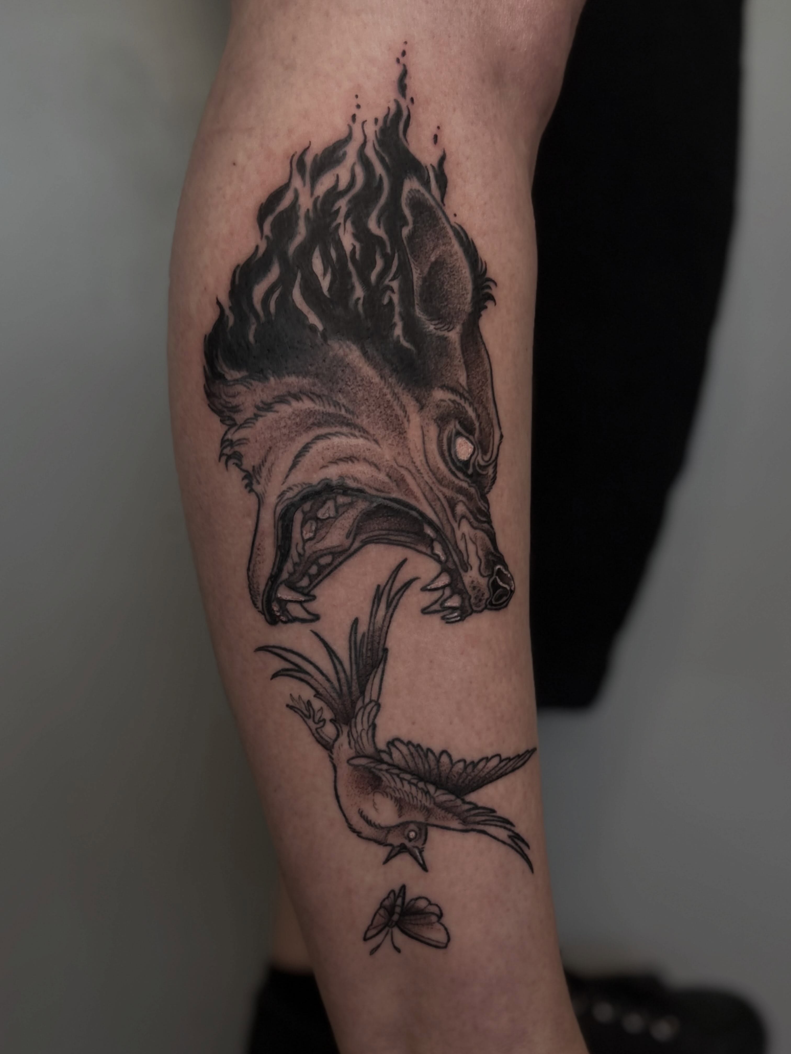 Wolf and bird realism tattoo on the forearm by Destiny Illustration