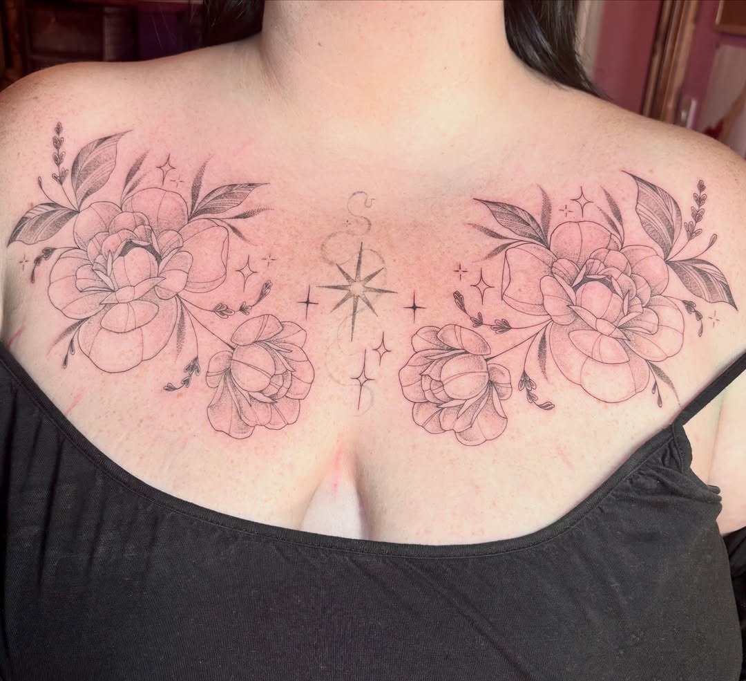 Flowers and stars black and grey tattoo on the chest by Charlotte Brown, Leeds, England